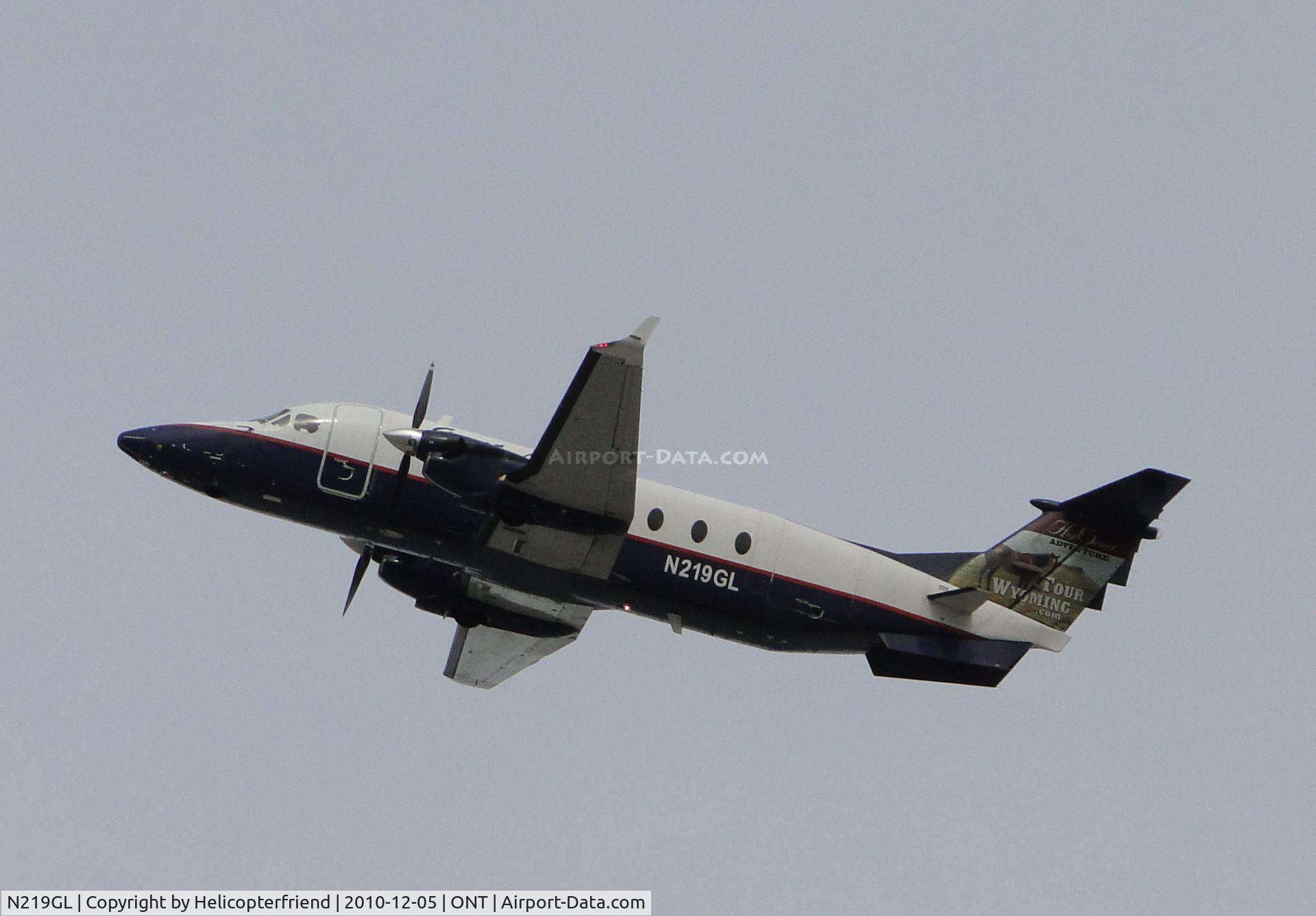 N219GL, 1996 Beech 1900D C/N UE-219, Great Lakes 1900D taking off from runway 26R and heading west