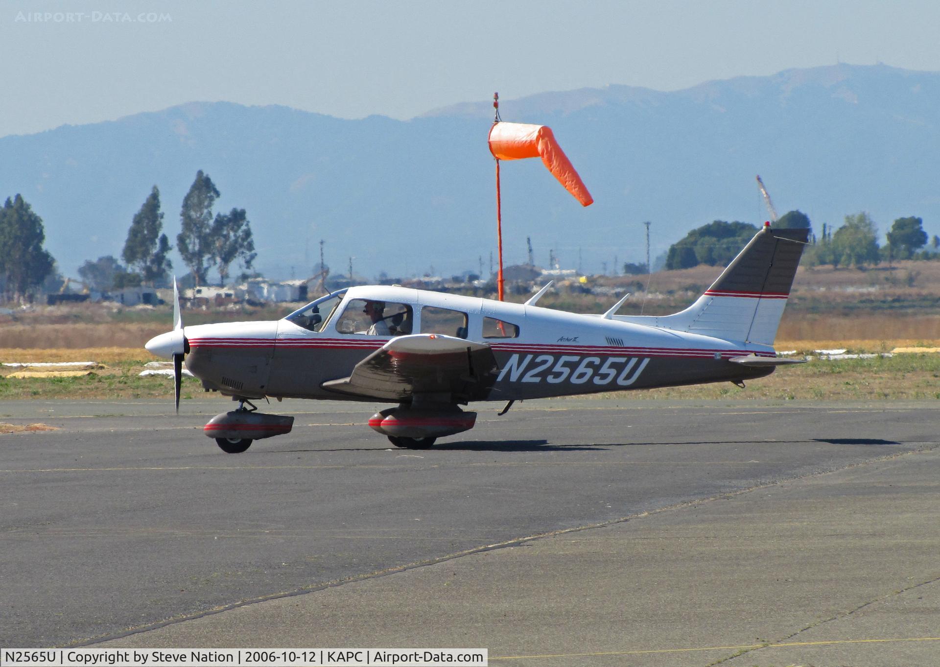 N2565U, 1979 Piper PA-28-181 C/N 28-8090058, Village Flyers (Napa, CA) 1979 Piper PA-28-181 taxiing with Napa River in background @ Napa County Airport, CA