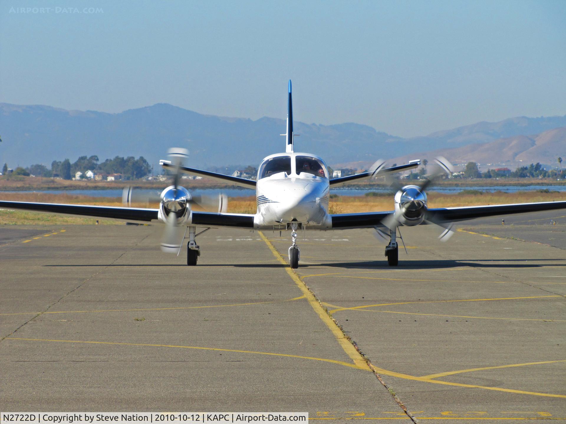 N2722D, 1980 Cessna 441 Conquest II C/N 441-0168, Head-on of USA Gasoline (Newbury Park, CA) 1980 Cessna 441 taxiing in with Napa River in background @ Napa County Airport, CA