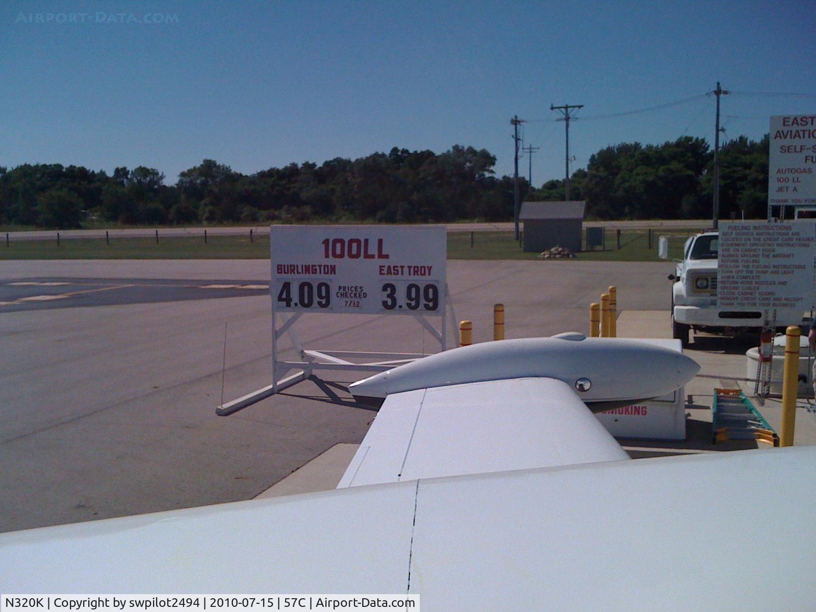 N320K, 1961 Cessna 320 Skyknight C/N 320-0018, Fueling up at East Troy