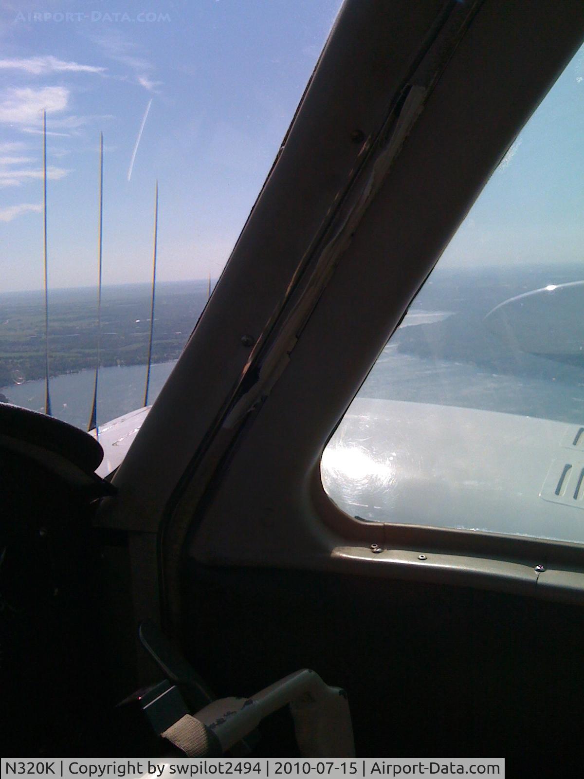 N320K, 1961 Cessna 320 Skyknight C/N 320-0018, Passing to the east of Lake Geneva, WI southbound.