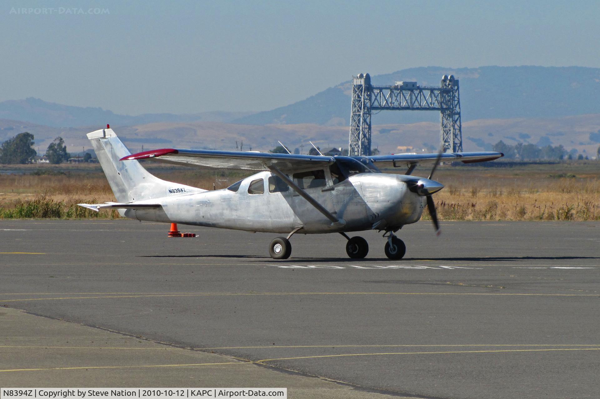 N8394Z, 1963 Cessna 210-5(205) C/N 205-0394, Brushed silver 1963 Cessna 210-5(205) with Napa River RR Bridge in background visiting from South County Airport/San Martin, CA @ Napa County Airport, CA