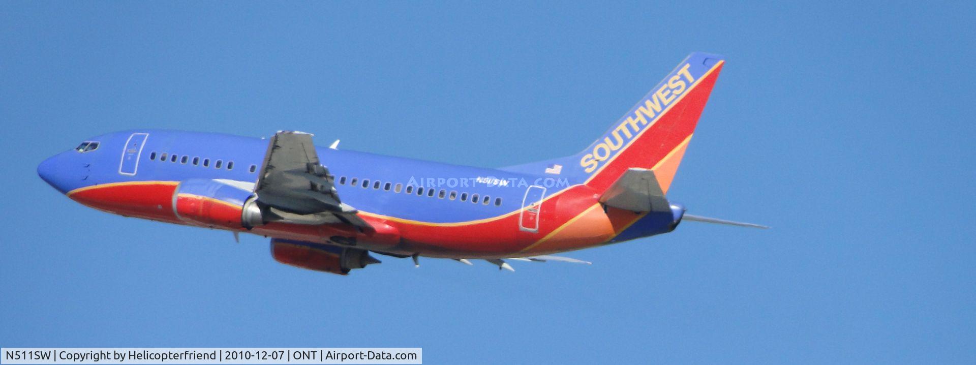 N511SW, 1991 Boeing 737-5H4 C/N 24188, Taking off from runway 26R and heading westbound