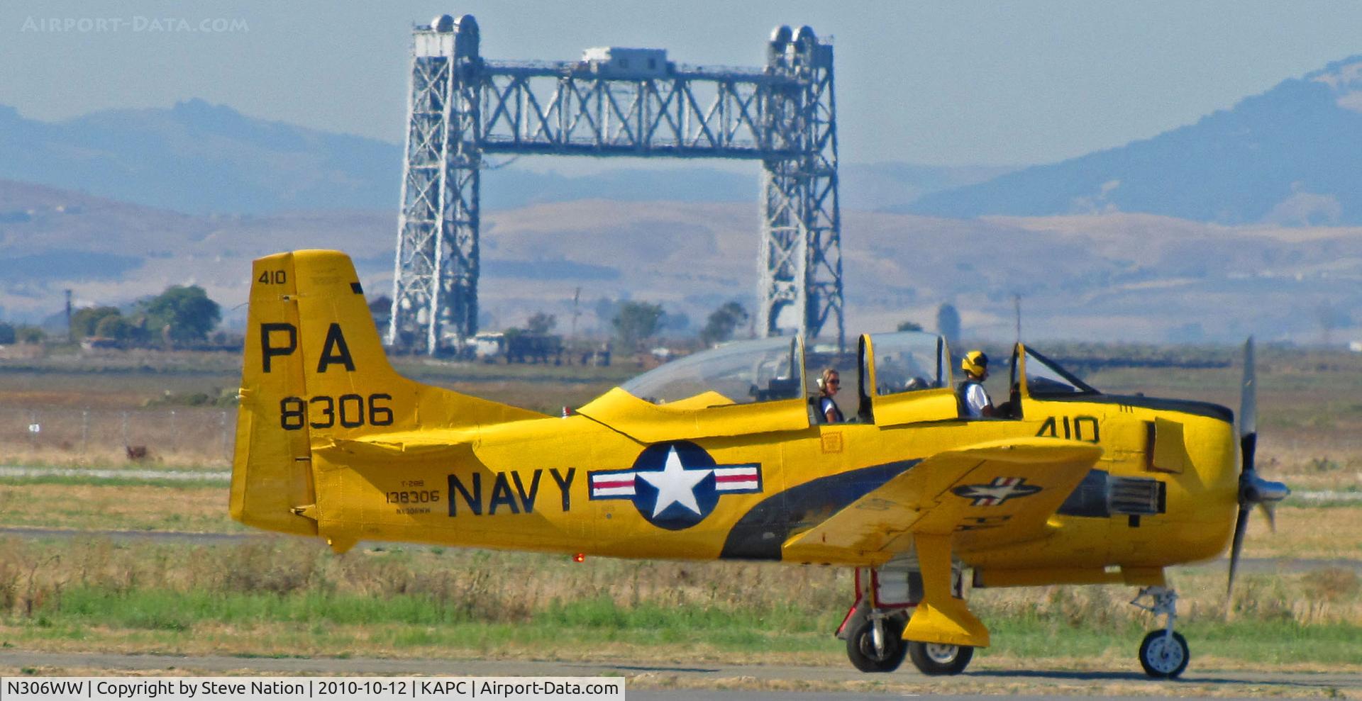 N306WW, 1955 North American T-28B Trojan C/N 200-377, Napa River RR Bridge in background frames this shot of 1955 T-28B BuAer 138306 in yellow US Navy training scheme marked as PA-410 and NX306WW taxis for take-off at Napa County Airport, CA home base