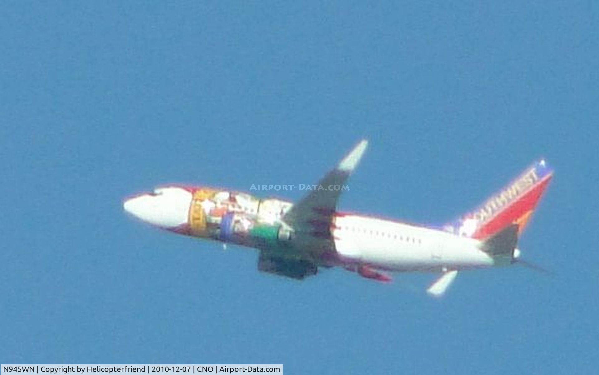 N945WN, 2010 Boeing 737-7H4 C/N 36660, Standing in Flo's Cafe parking lot at CNO, looking north and observing Southwest 