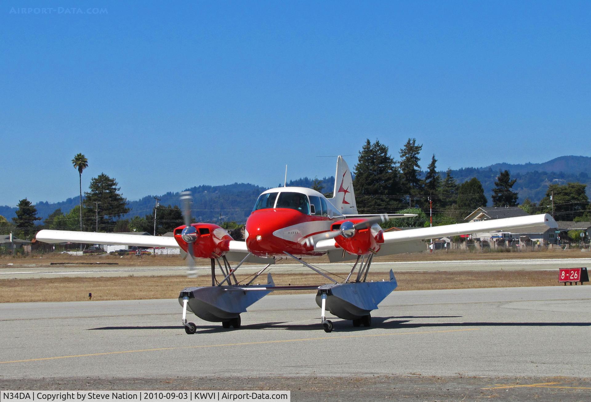 N34DA, 1958 Piper PA-23-160 Apache C/N 23-1469, Head on shot of Float-equipped 1958 Piper PA-23-160 from San Andreas, CA turning onto parking ramp @ 2010 Watsonville Fly-in