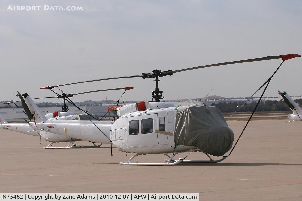 N75462, 1974 Western International Avia Inc UH-1H C/N 74-22351, One of six Dyncorp UH-1H's on the ramp at Alliance Airport - Fort Worth, TX ( These aircraft may be for use in Iraq)