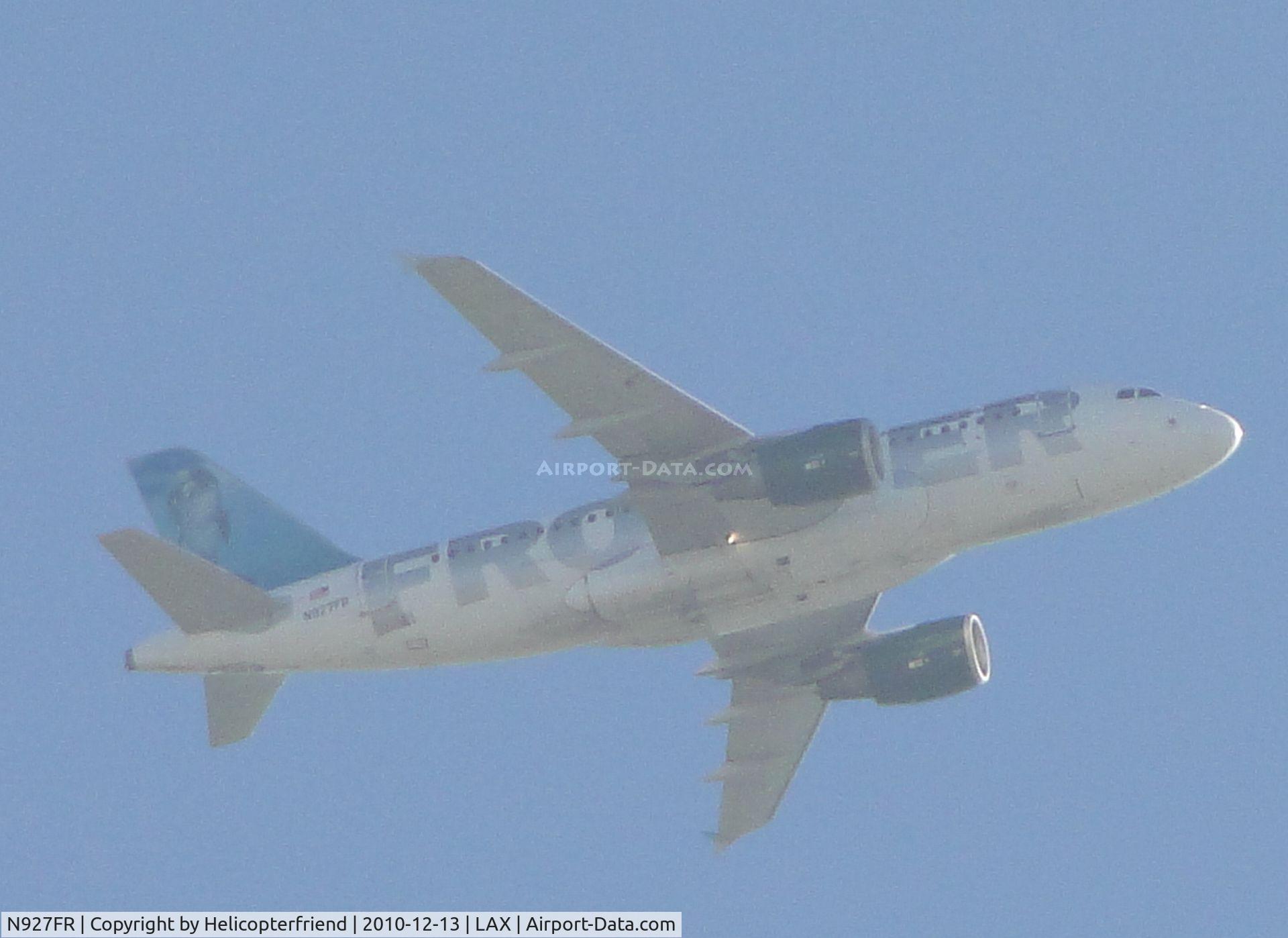 N927FR, 2004 Airbus A319-111 C/N 2209, On a real hazy day, on Final to runway 24 flying over the City of Bell, Califonia, approximately 15 miles east of LAX