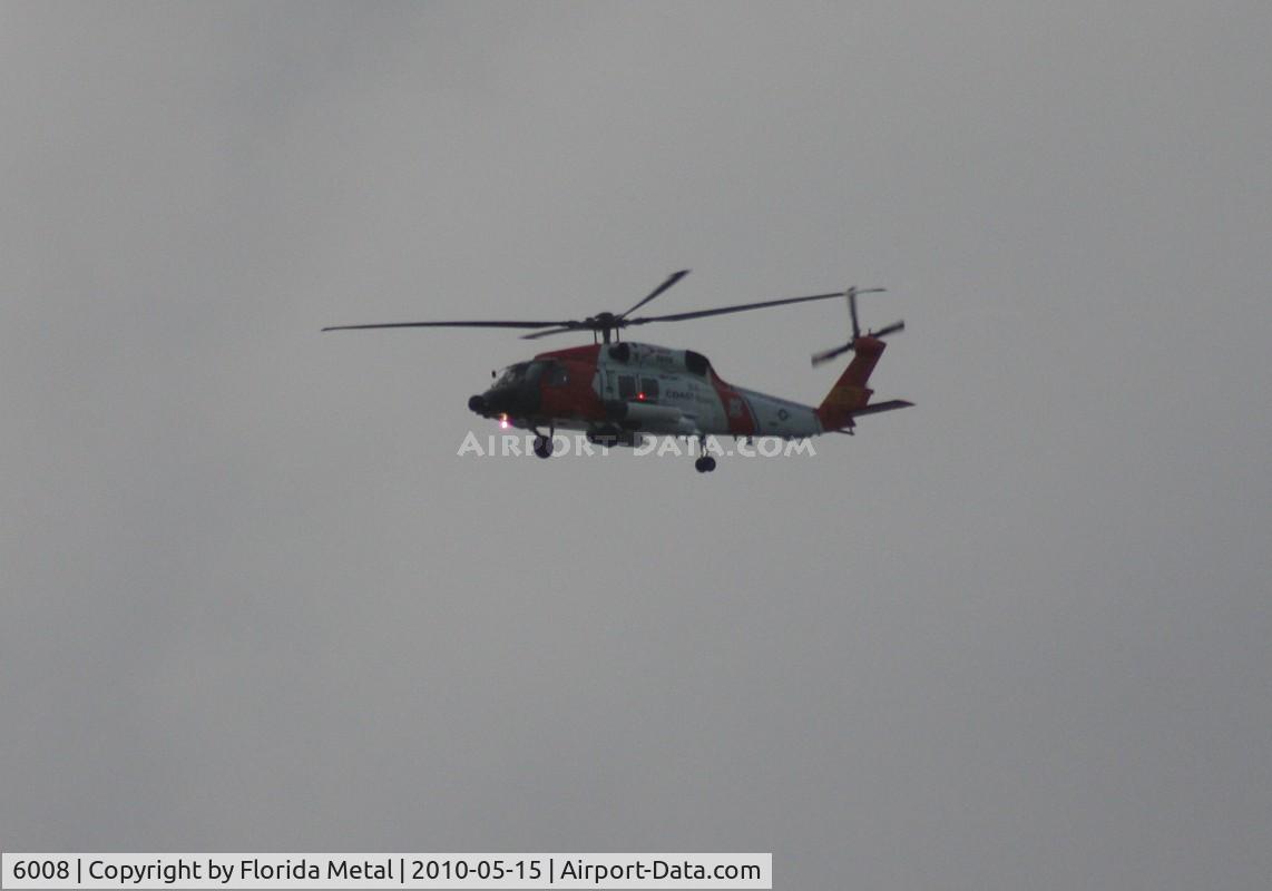 6008, Sikorsky MH-60J Jayhawk C/N 70.1565, MH-60J Coast Guard flying along Passe A Grille Beach south of St. Pete FL at dusk