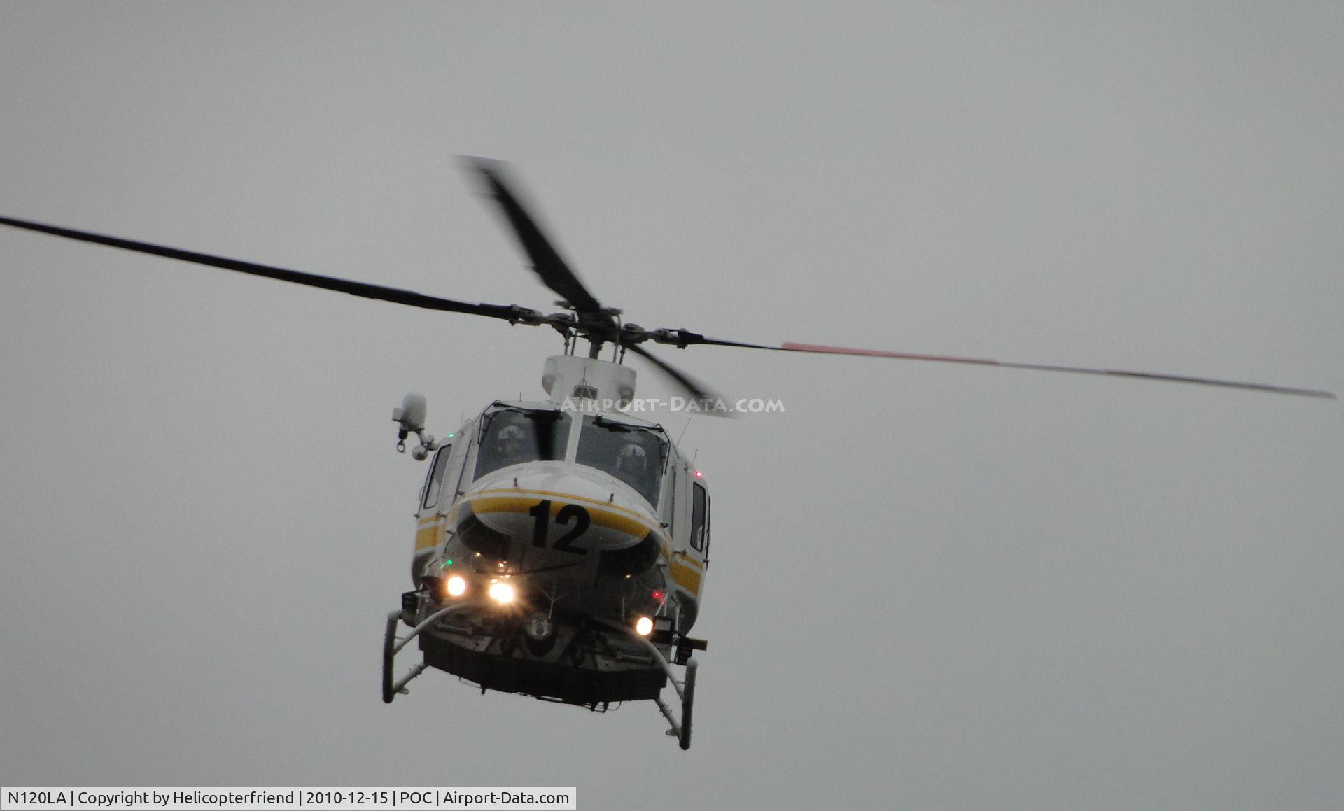 N120LA, 2007 Bell 412EP C/N 36455, Slowing down in preparation to turn south, to land on helipad where ambulance and paramedics are standing by