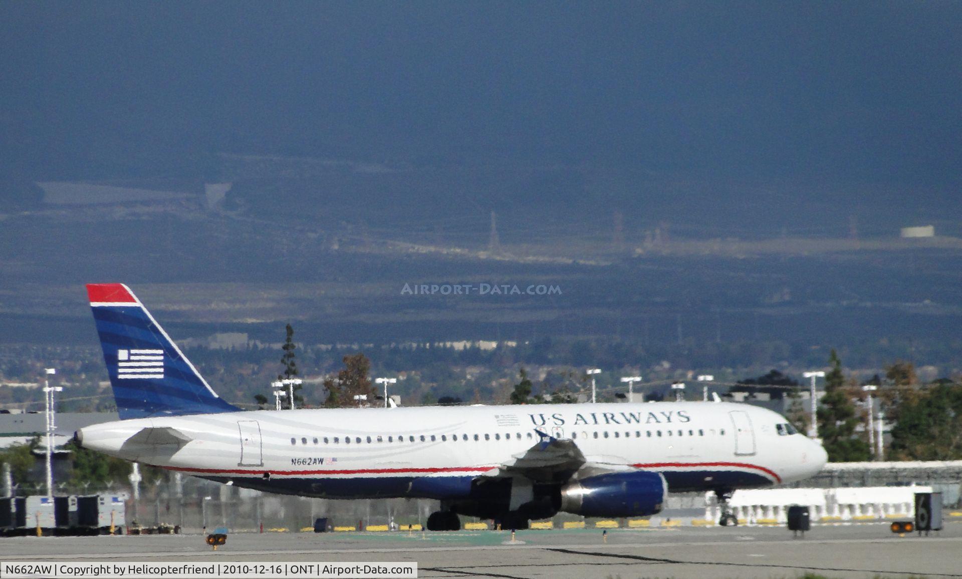 N662AW, 2000 Airbus A320-232 C/N 1274, Landed on runway 26L, crossed runway 26R and is taxiing to terminal
