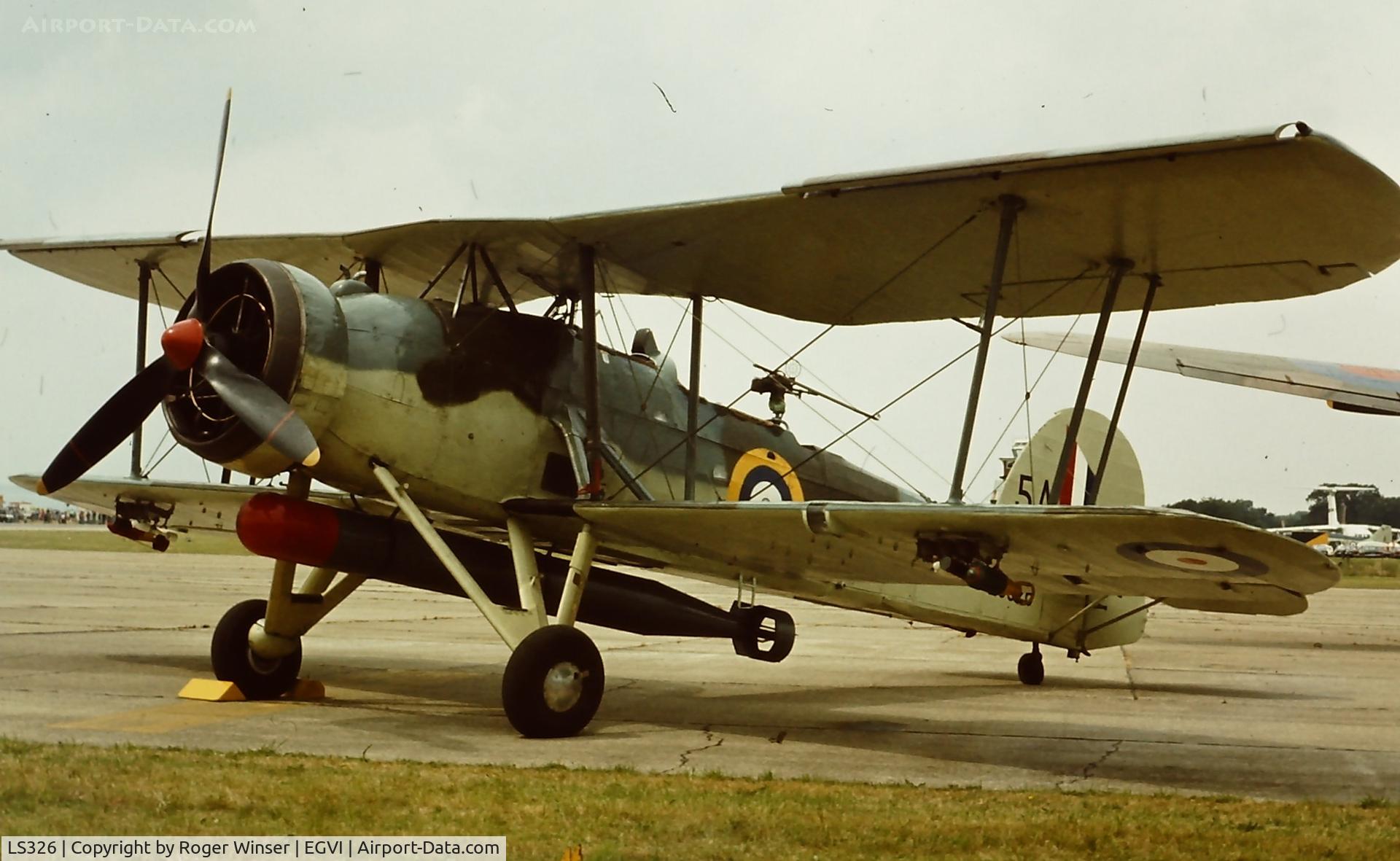 LS326, 1943 Fairey Swordfish Mk.II C/N Not found LS326, RNHF Swordfish LS326/5A at the IAT held at RAF Greenham Common, UK (date guess is July 1974). Registered G-AJVH from 1947 to 1959