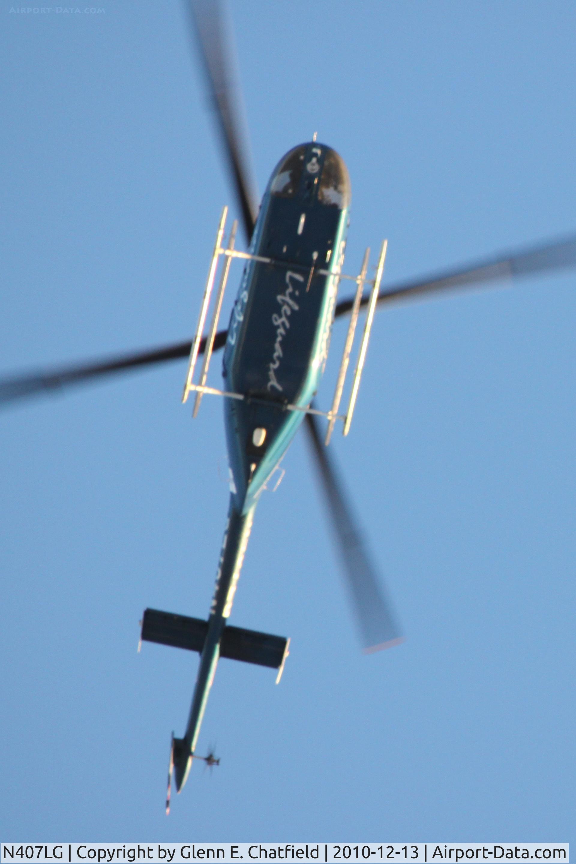 N407LG, 1997 Bell 407 C/N 53143, Flying north over my house in North Liberty, IA.  Traveling from University of Iowa Hospital in Iowa City to St. Luke's Hospital in Cedar Rapids.