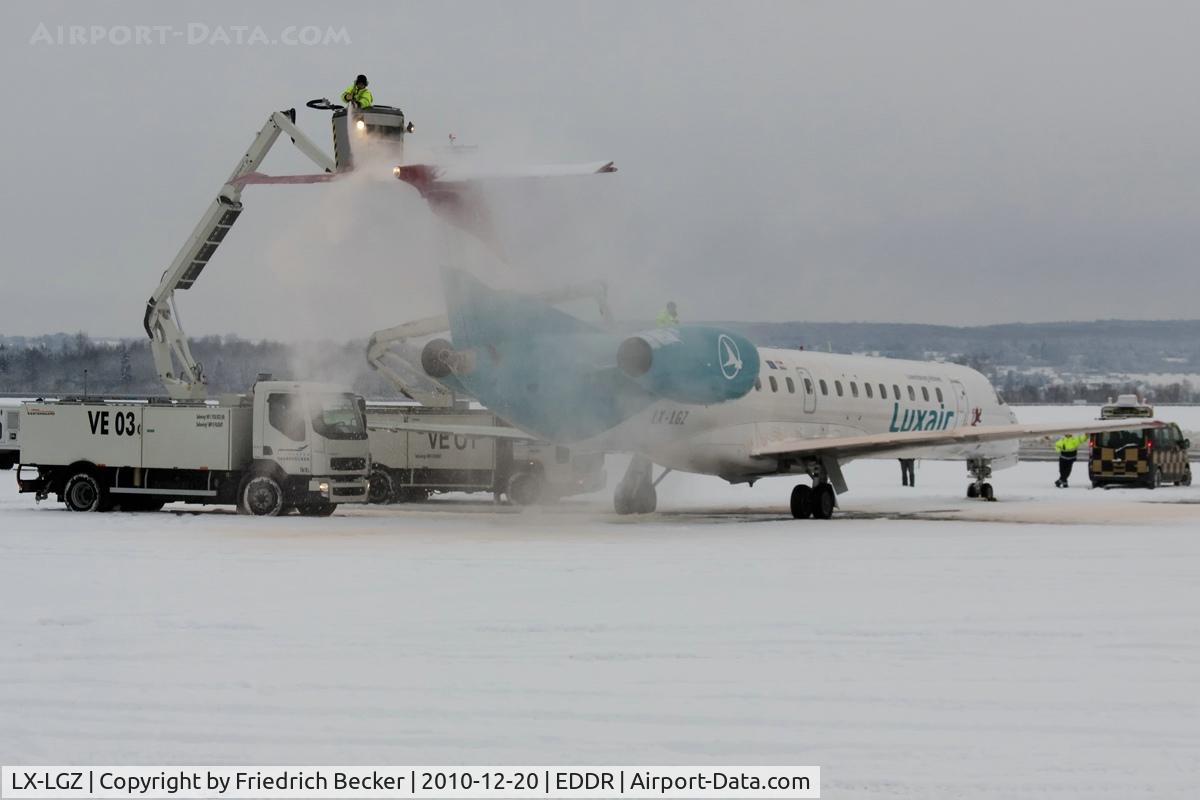 LX-LGZ, 2000 Embraer EMB-145LU (ERJ-145LU) C/N 145258, de-icing prior departure