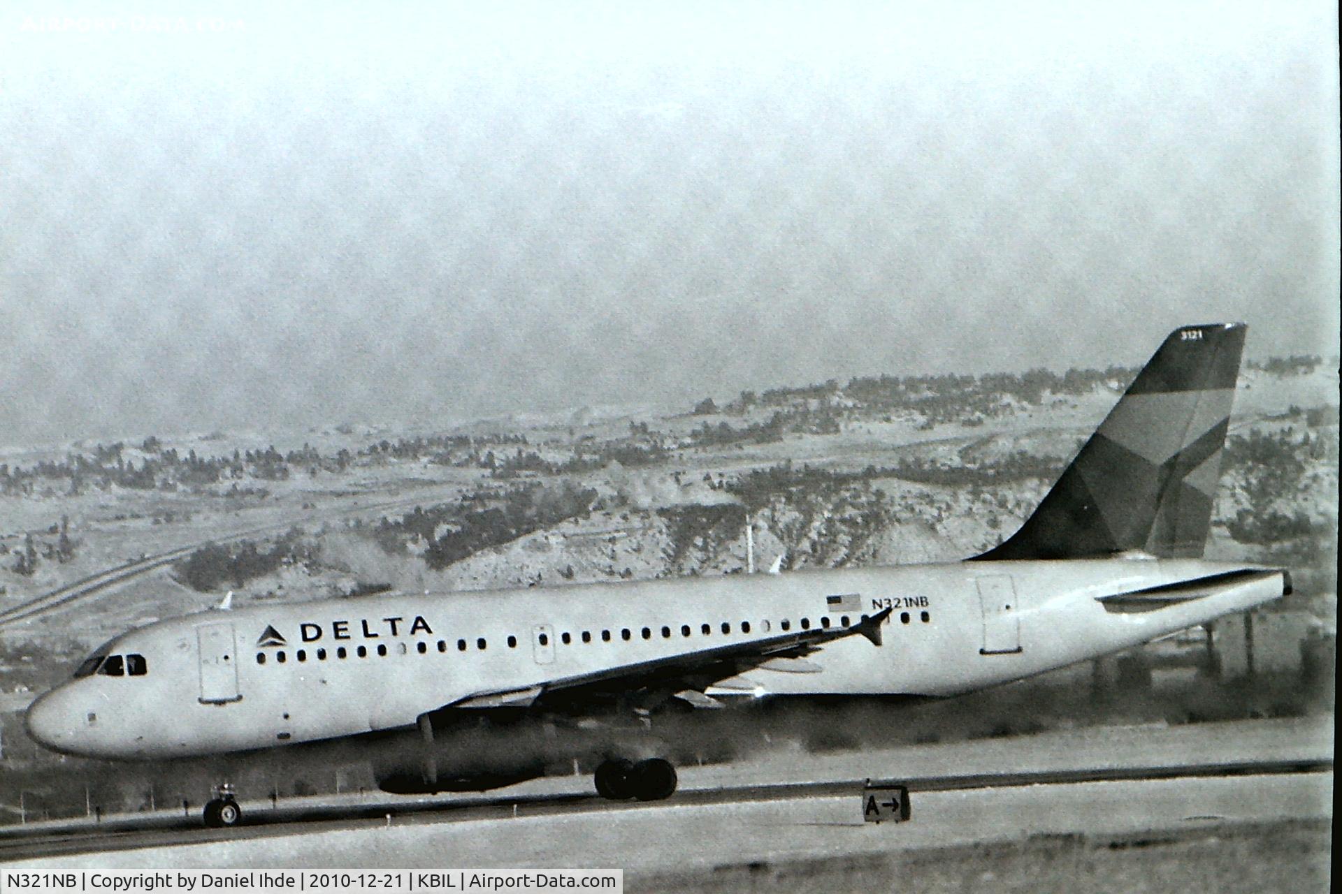 N321NB, 2001 Airbus A319-114 C/N 1414, Delta Airbus A319 departing KBIL 12-21-2010.  Doing a bit more experimenting with developing B/W film.