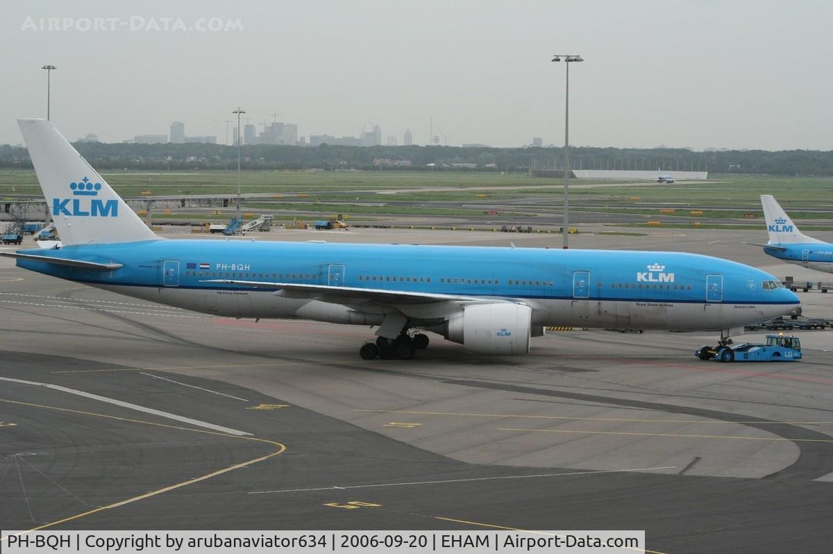 PH-BQH, 2004 Boeing 777-206/ER C/N 32705, The mighty 777 pushing back. Notice the high rise buildings in the horizon