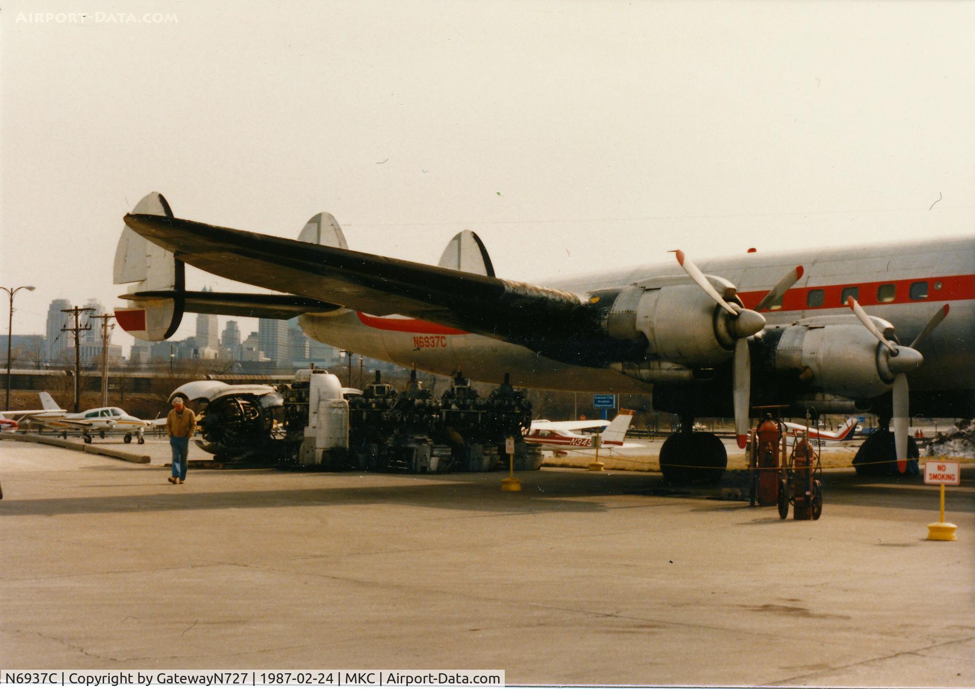 N6937C, 1957 Lockheed L-1049H-82 Super Constellation C/N 4830, I believe the engines under the tail were to be installed on the aircraft. The gentleman in the tan jacket is a retired TWA Connie pilot who was kind enough to take me inside the aircraft.
