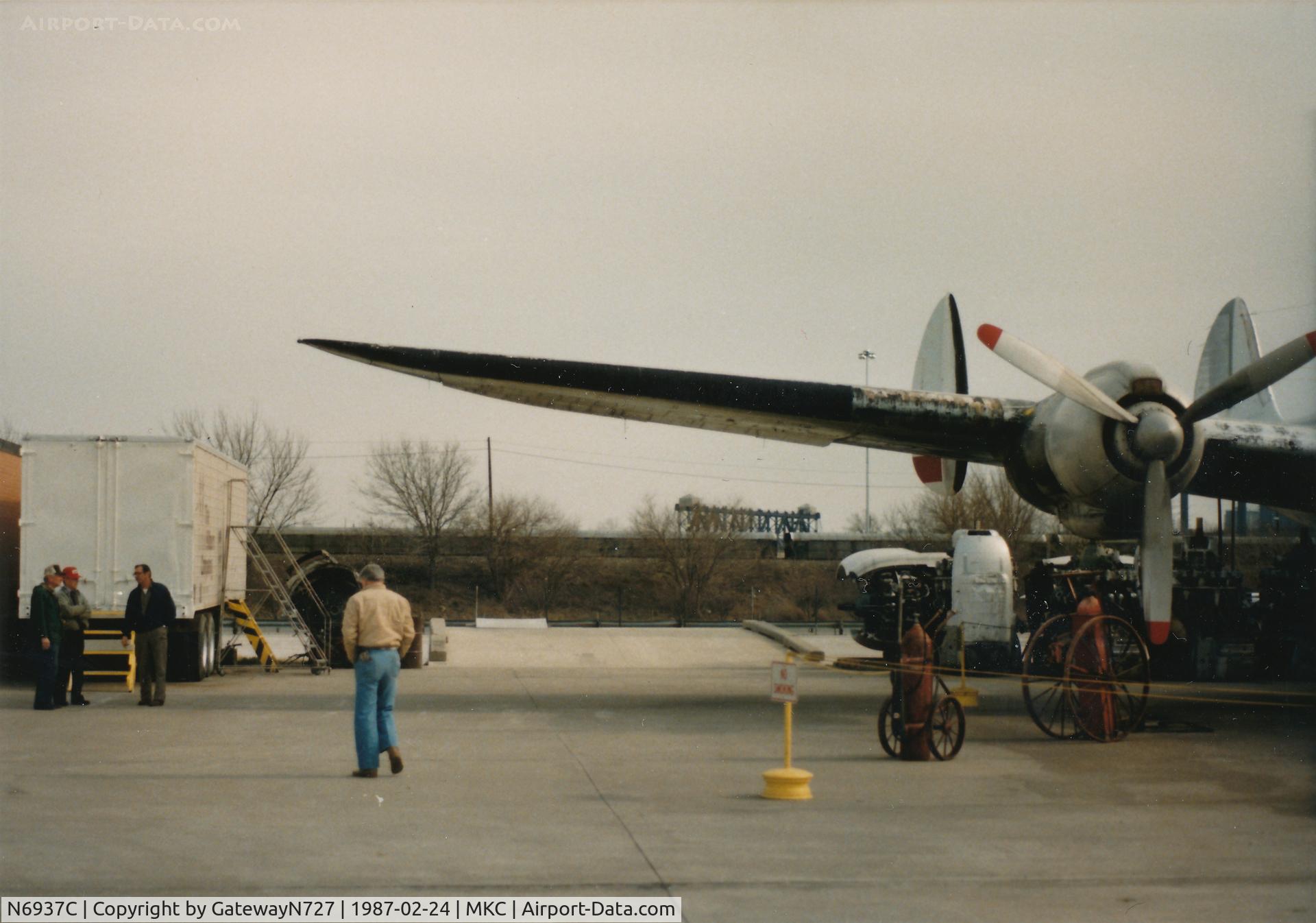N6937C, 1957 Lockheed L-1049H-82 Super Constellation C/N 4830, The number 4 engine and some of the original Save a Connie crew on the left. Ex-TWA Connie pilot walking away from the camera in the tan coat who allowed me to tour the aircraft.