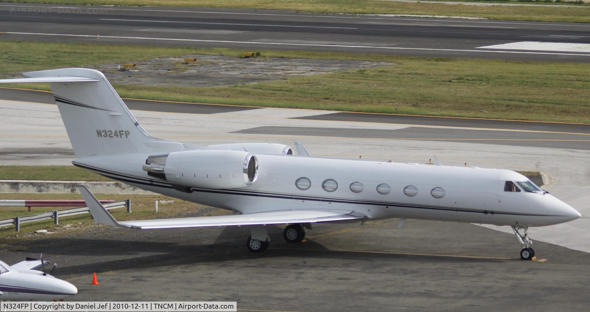 N324FP, 2002 Gulfstream Aerospace G-IV C/N 1475, N324FP park at the cargo ramp at TNCM