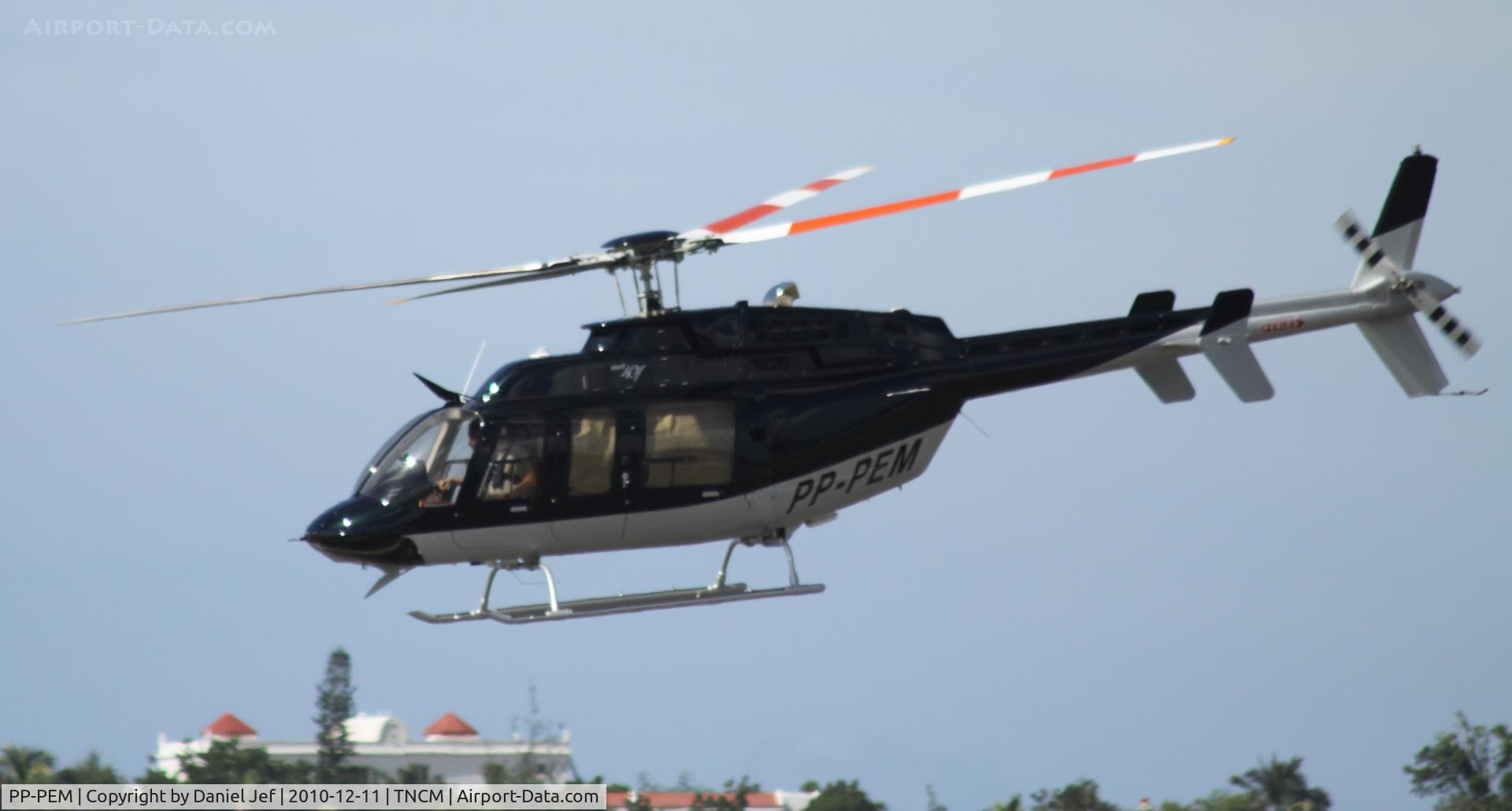 PP-PEM, Bell 407 C/N 53985, PP-PEM departing the helipad at TNCM