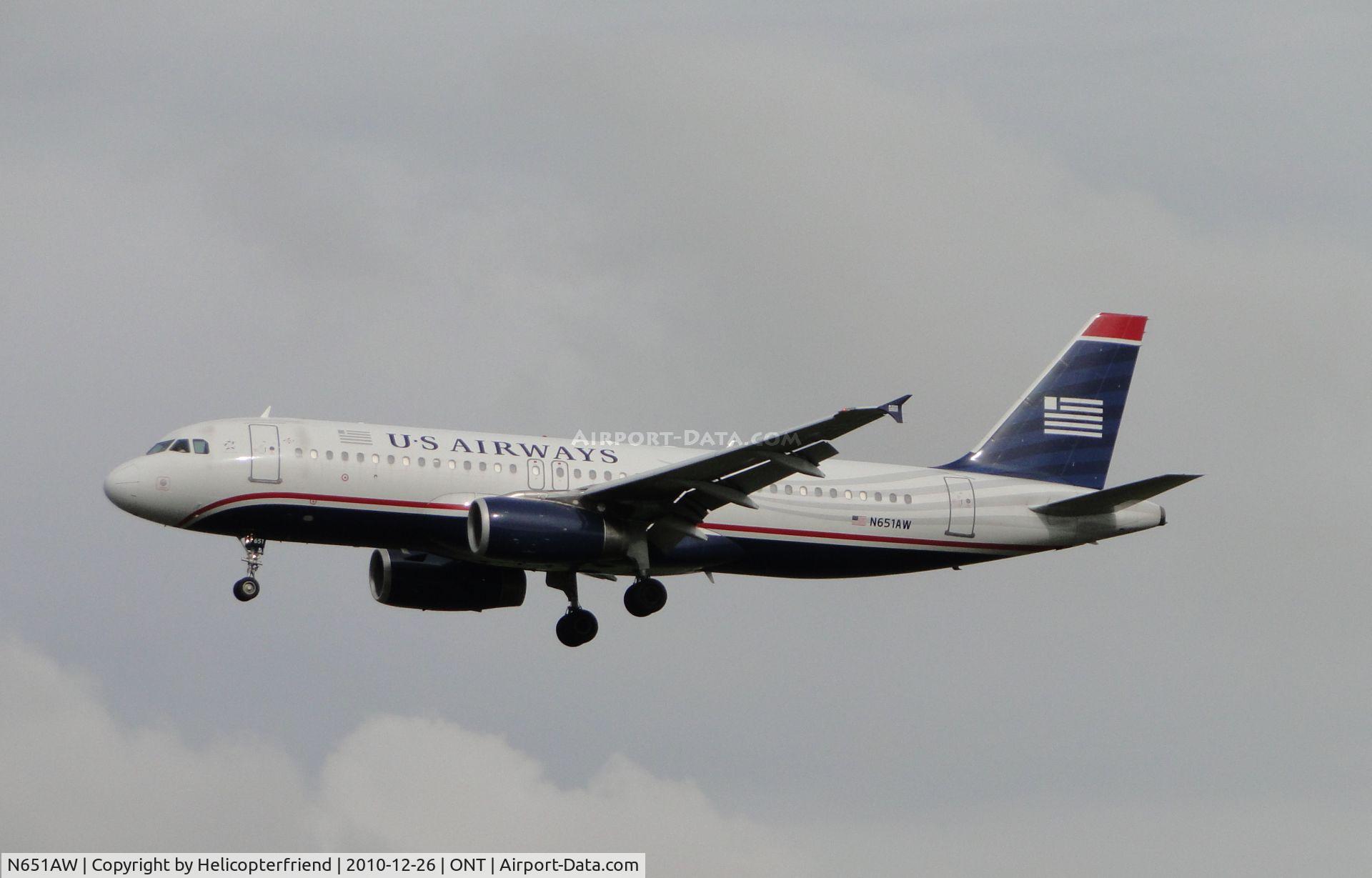 N651AW, 1998 Airbus A320-232 C/N 866, On final to runway 26L on a very overcast day