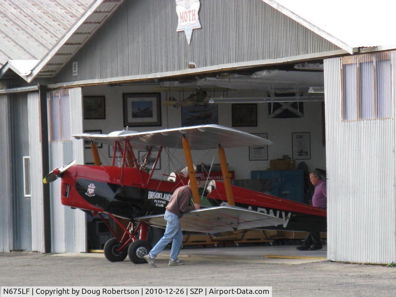 N675LF, 1944 De Havilland DH-82A Tiger Moth II C/N 86572, 1944 DeHavilland DH82A TIGER MOTH, DeHavilland Gipsy Major I 4 cylinder air-cooled inverted 135 Hp, putting her in the hangar.