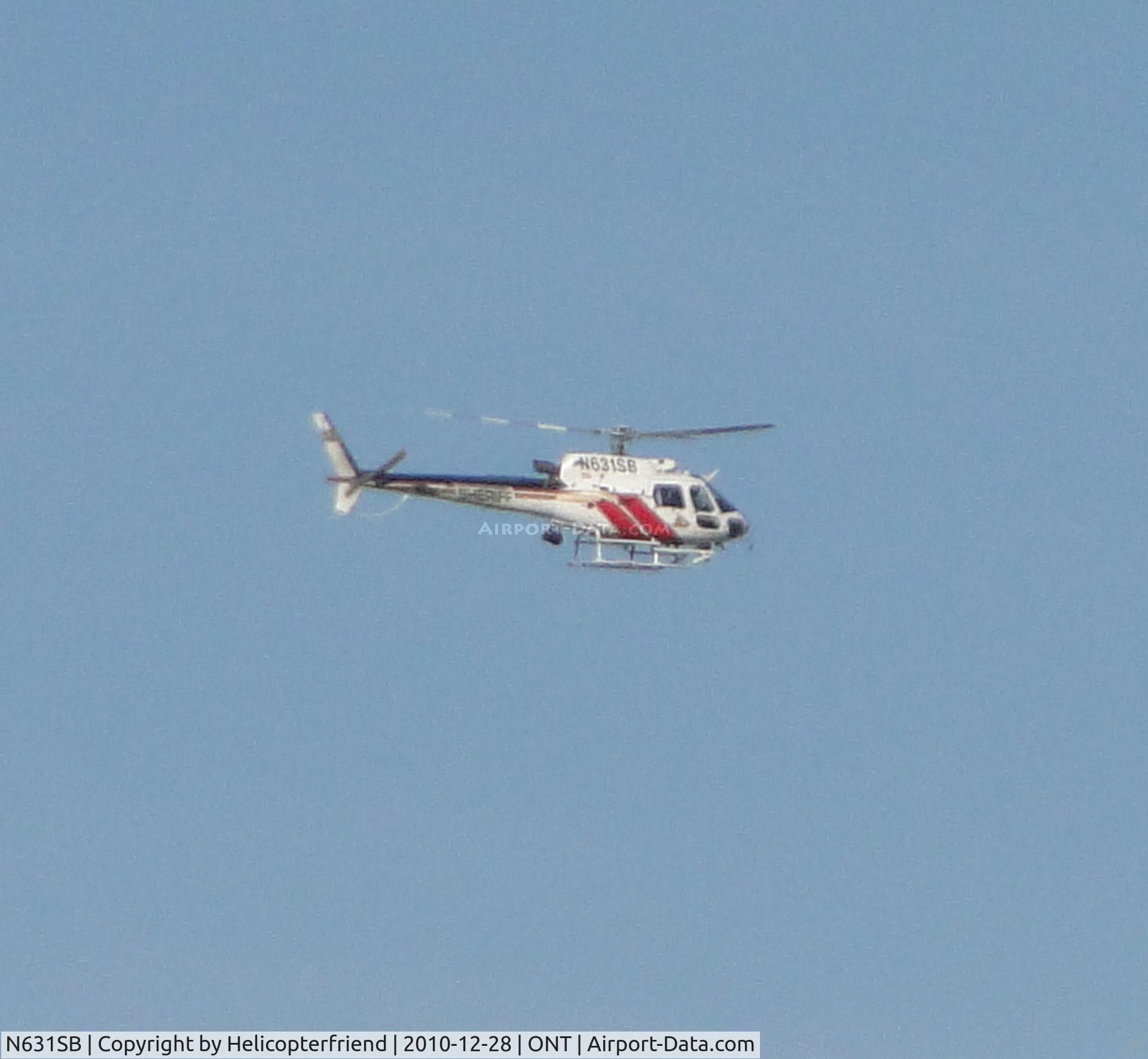 N631SB, 2004 Eurocopter AS-350B-3 Ecureuil Ecureuil C/N 3891, North east bound at 2500 ft at the west end, above Ontario
