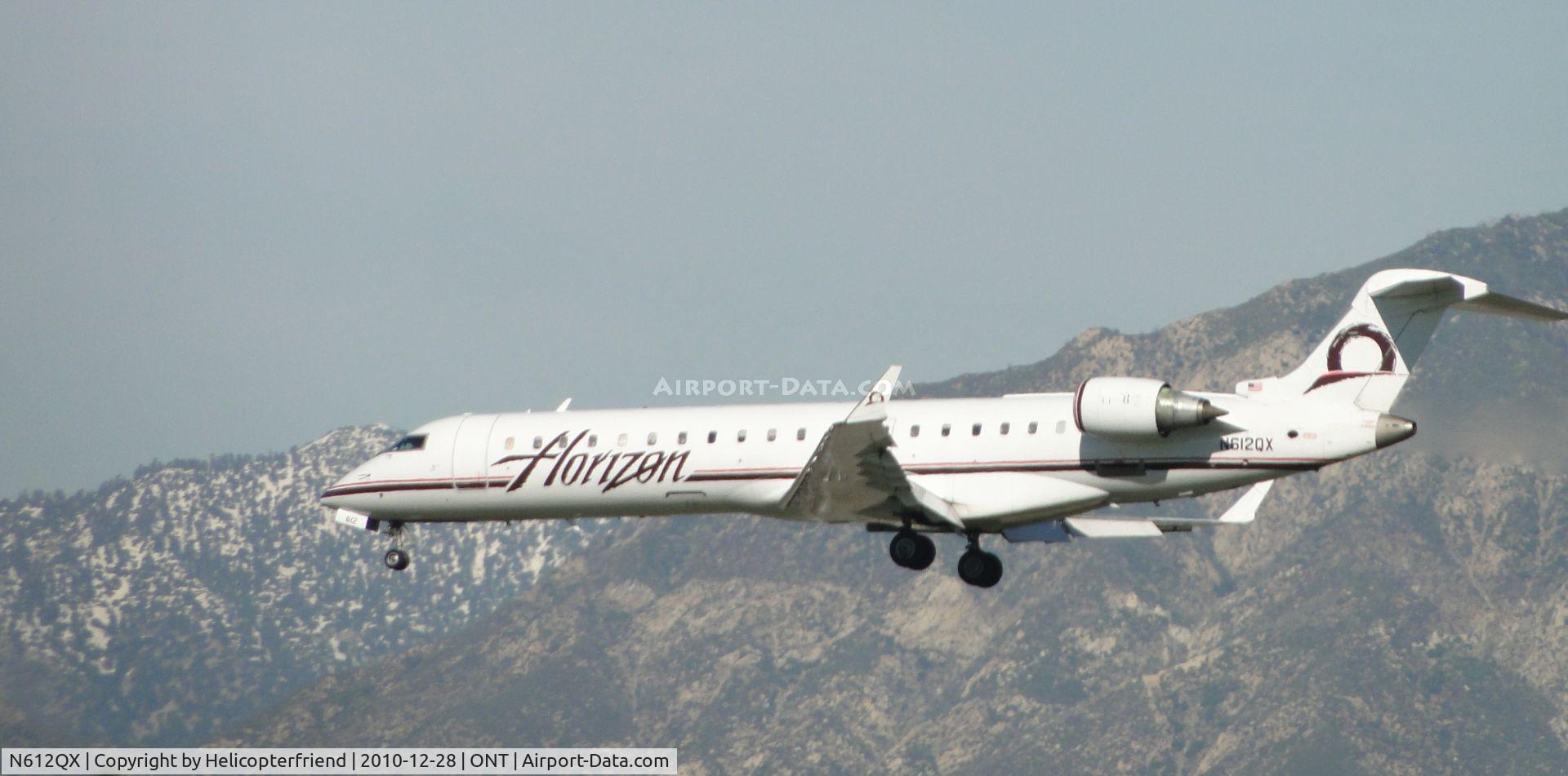 N612QX, 2002 Bombardier CRJ-701 (CL-600-2C10) Regional Jet C/N 10042, On final, approaching the threshold to runway 26R