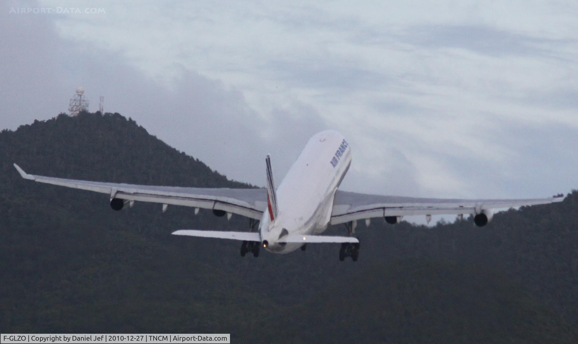 F-GLZO, 1998 Airbus A340-313X C/N 246, Gats to get up and over them hills at TNCM