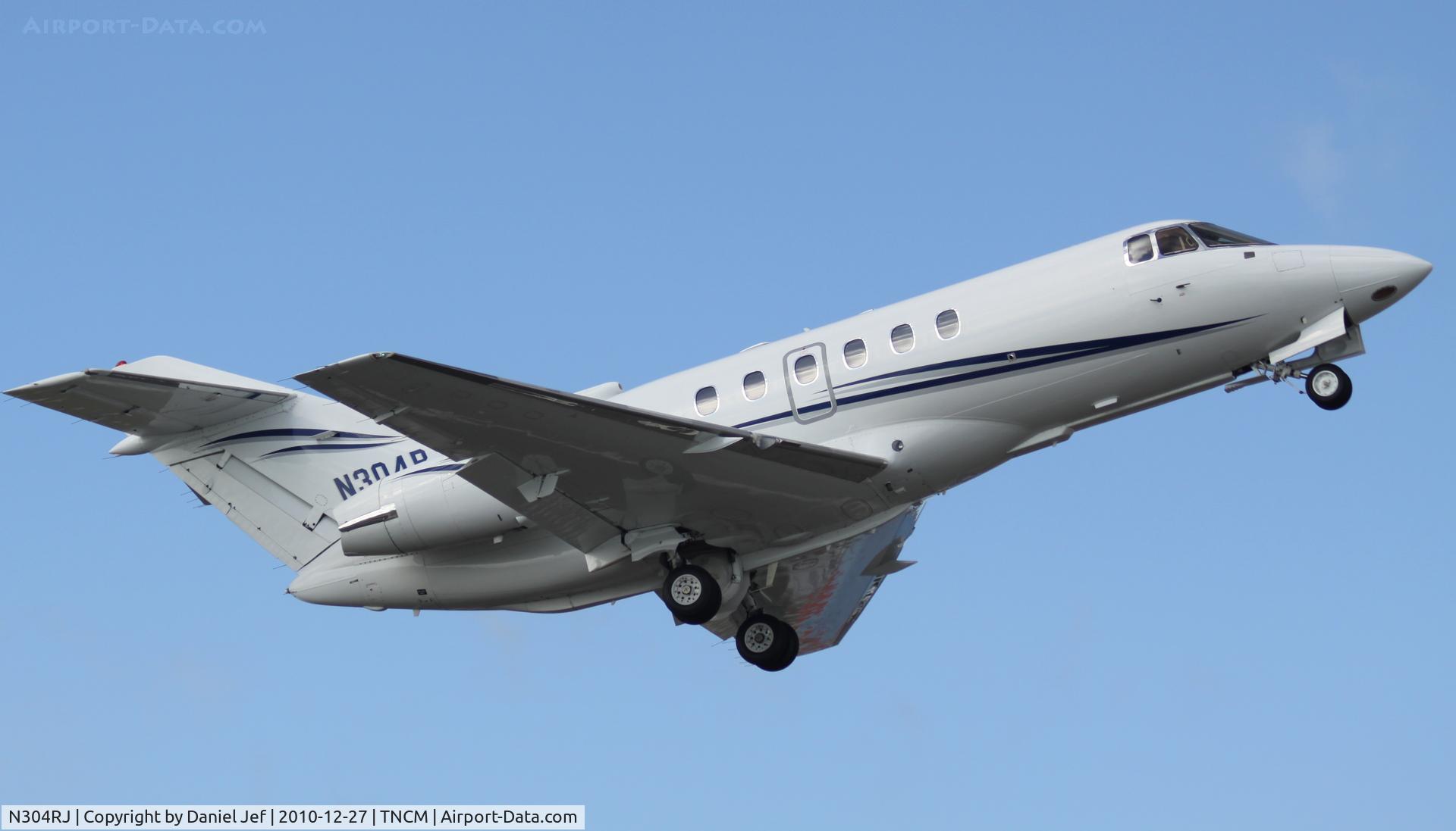 N304RJ, 1995 Raytheon Hawker 800XP C/N 258286, N304RJ departing TNCM