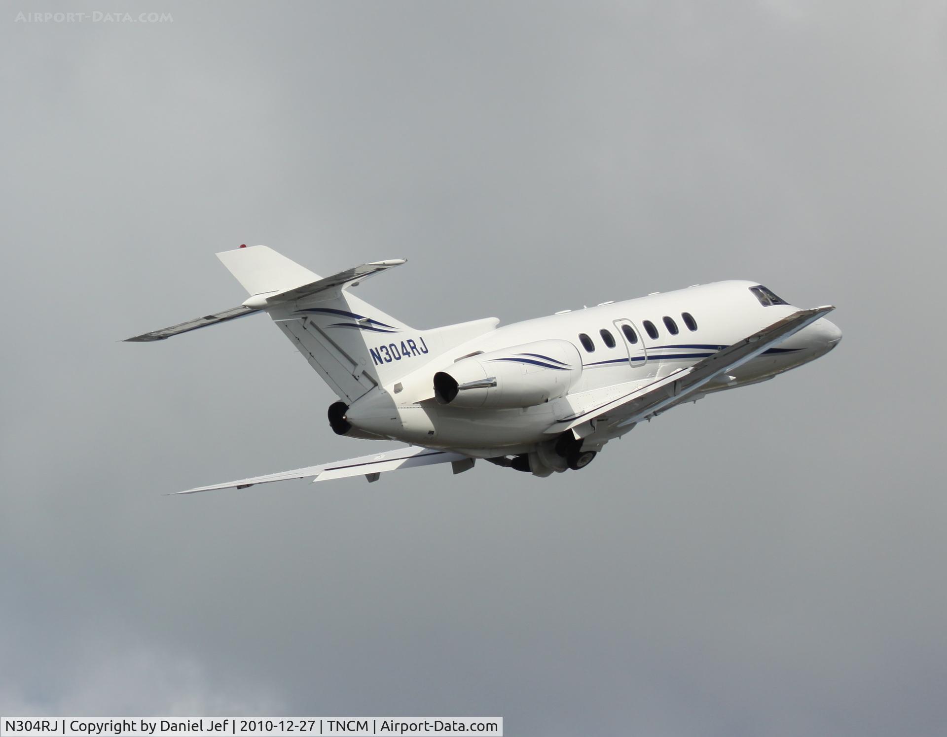 N304RJ, 1995 Raytheon Hawker 800XP C/N 258286, N304RJ gears up and away at TNCM