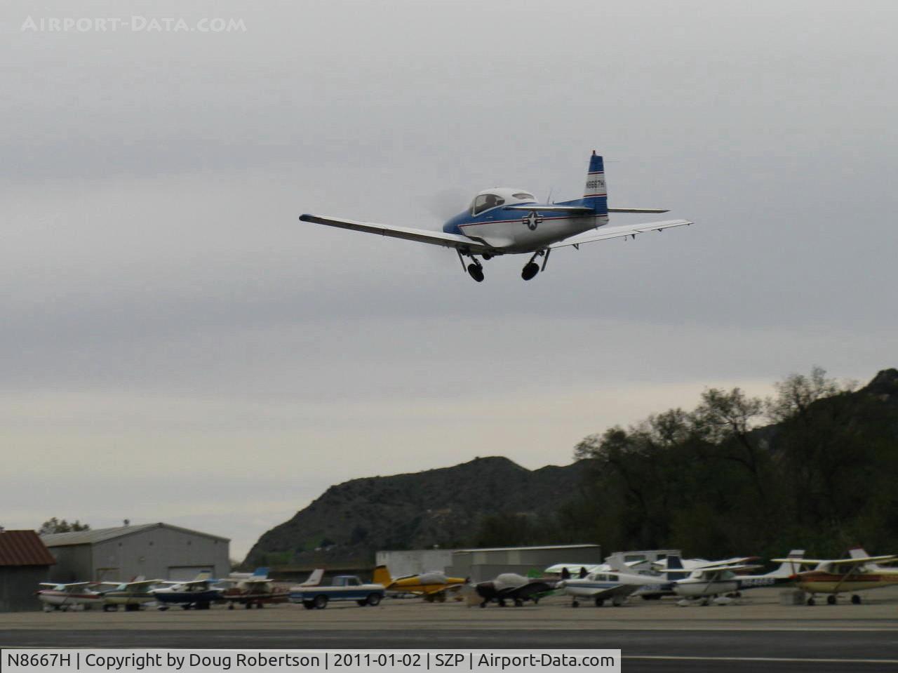 N8667H, 1947 North American Navion C/N NAV-4-667, 1947 North American NAVION, 285 Hp Continental upgrade, takeoff climb Rwy 04, gear coming up