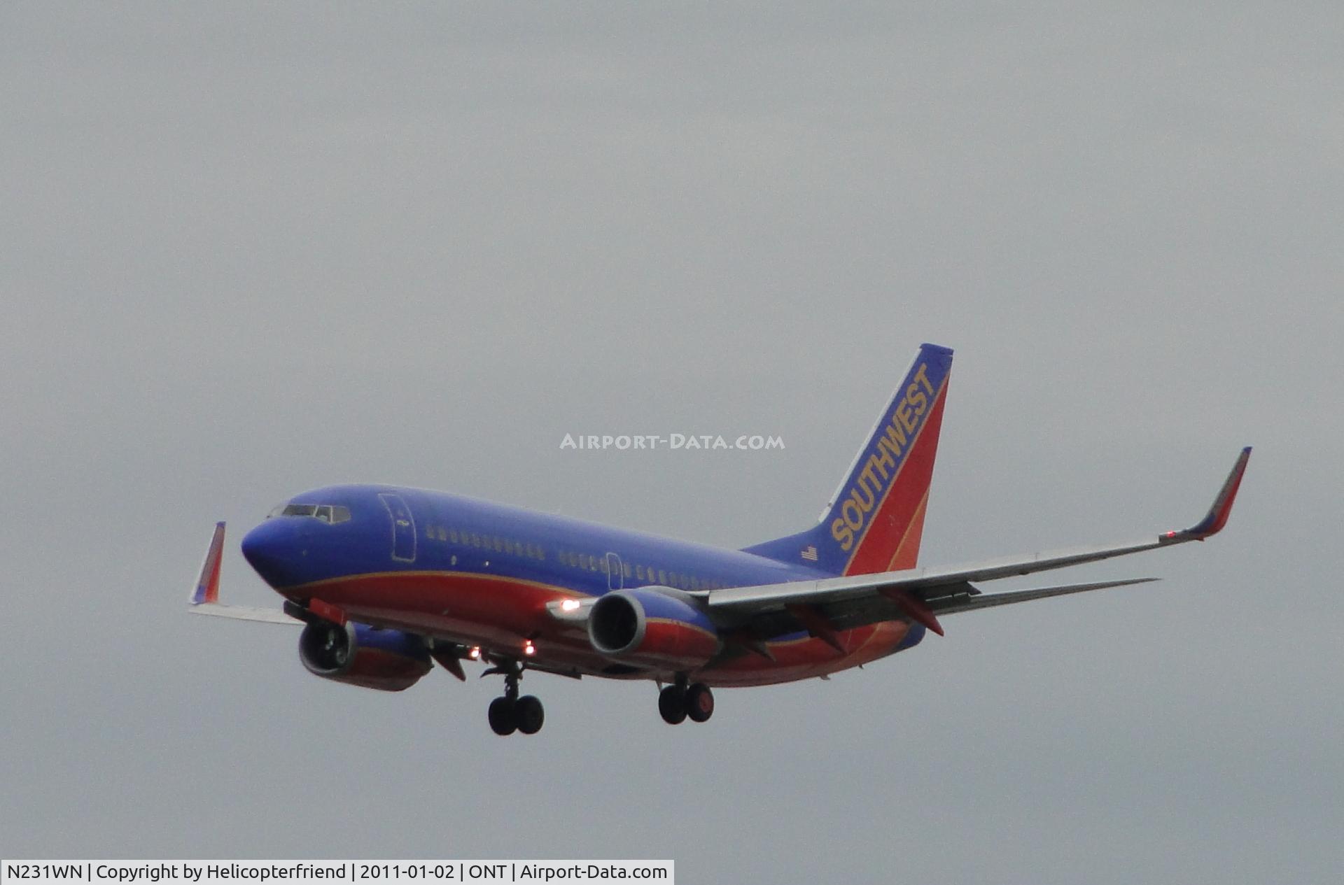 N231WN, 2006 Boeing 737-7H4 C/N 32499, On final to runway 26R on an overcast cold day