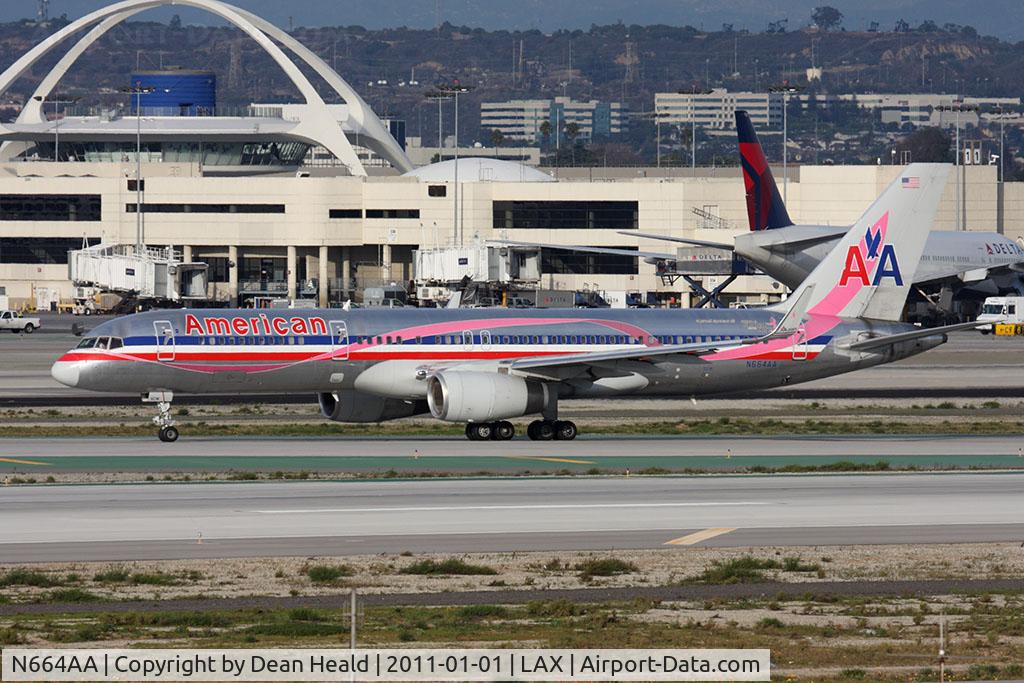 N664AA, 1992 Boeing 757-223 C/N 25298, American Airlines N664AA (FLT AAL239) holding short of RWY 25R at Taxiway Papa after arrival from Luis Munoz Marin Int'l (TJSJ/SJU). This aircraft's scheme is in recognition of the Susan G Komen breast cancer awareness program.