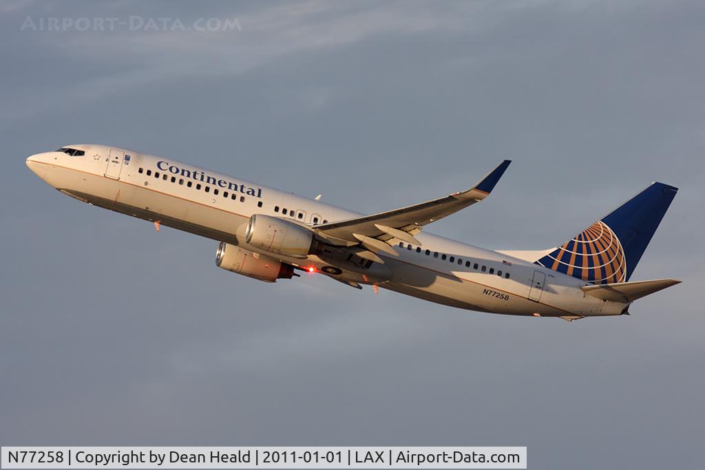N77258, 2000 Boeing 737-824 C/N 30802, Continental Airlines N77258 (FLT COA1503) climbing out from RWY 25R en route to Newark Liberty Intl (KEWR) late in the day.