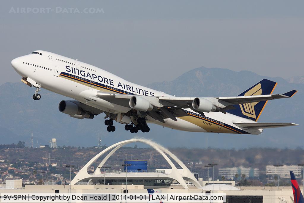 9V-SPN, 2001 Boeing 747-412 C/N 28031, Singapore Airlines 9V-SPN (FLT SIA11) climbing out from RWY 25R en route to Narita Intl (RJAA). Now with large titles.