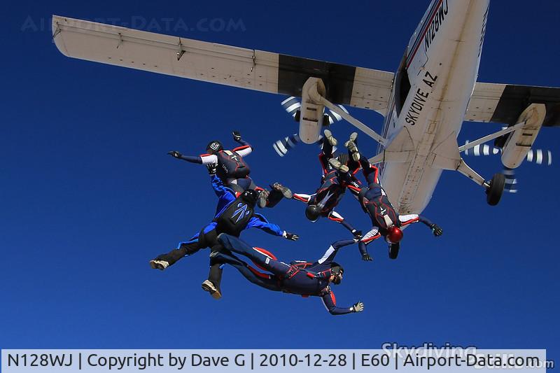N128WJ, 1968 De Havilland Canada DHC-6-200 Twin Otter C/N 128, Skydivers exit a Twin Otter over Skydive Arizona