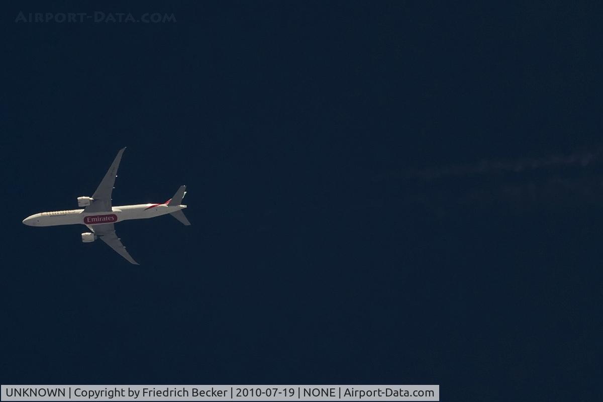 UNKNOWN, Contrails Various C/N Unknown, Emirates B777-300 cruising high