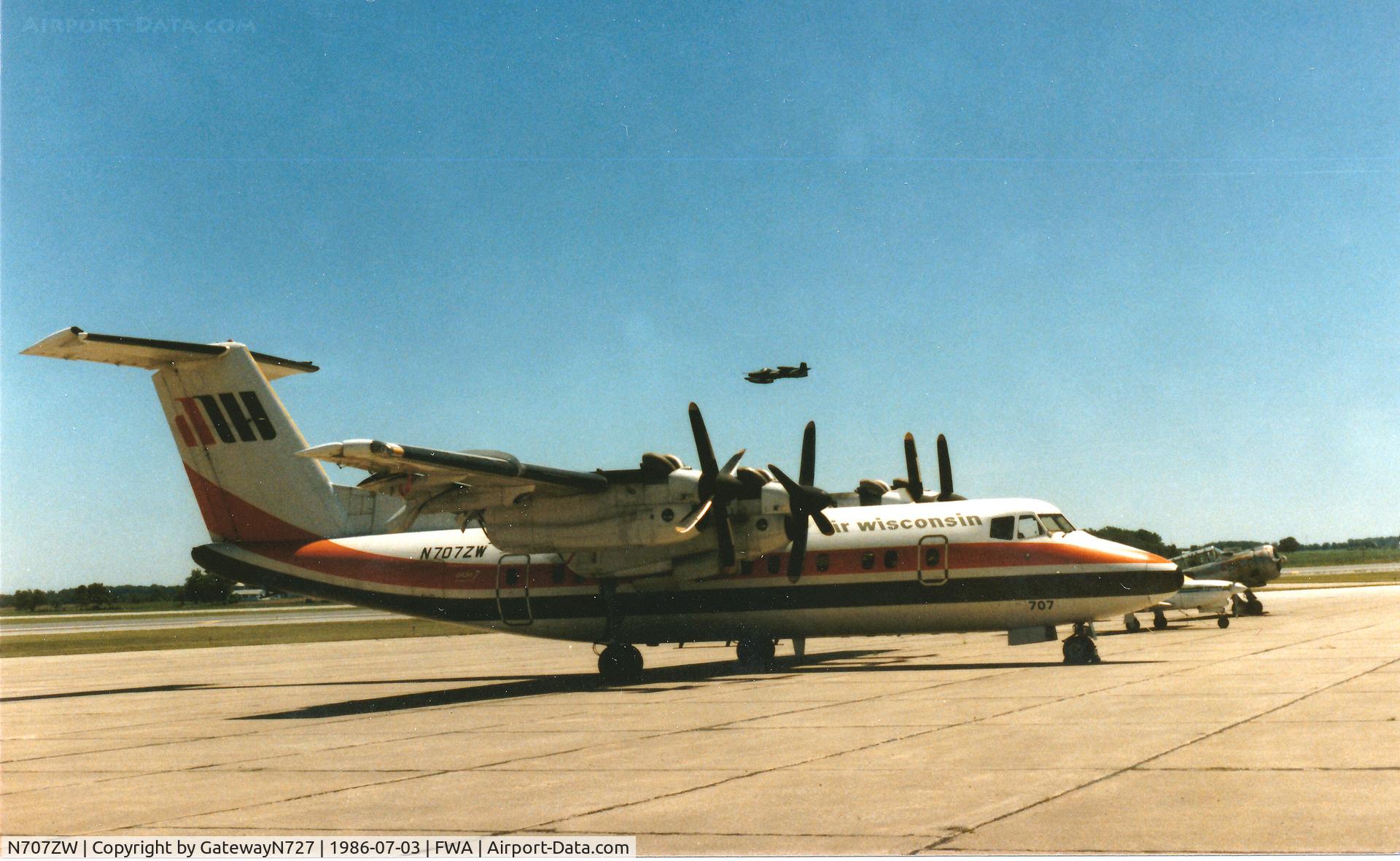 N707ZW, 1981 De Havilland Canada DHC-7-102 Dash 7 C/N 59, OA-37 passing overhead. Air Wisconsin