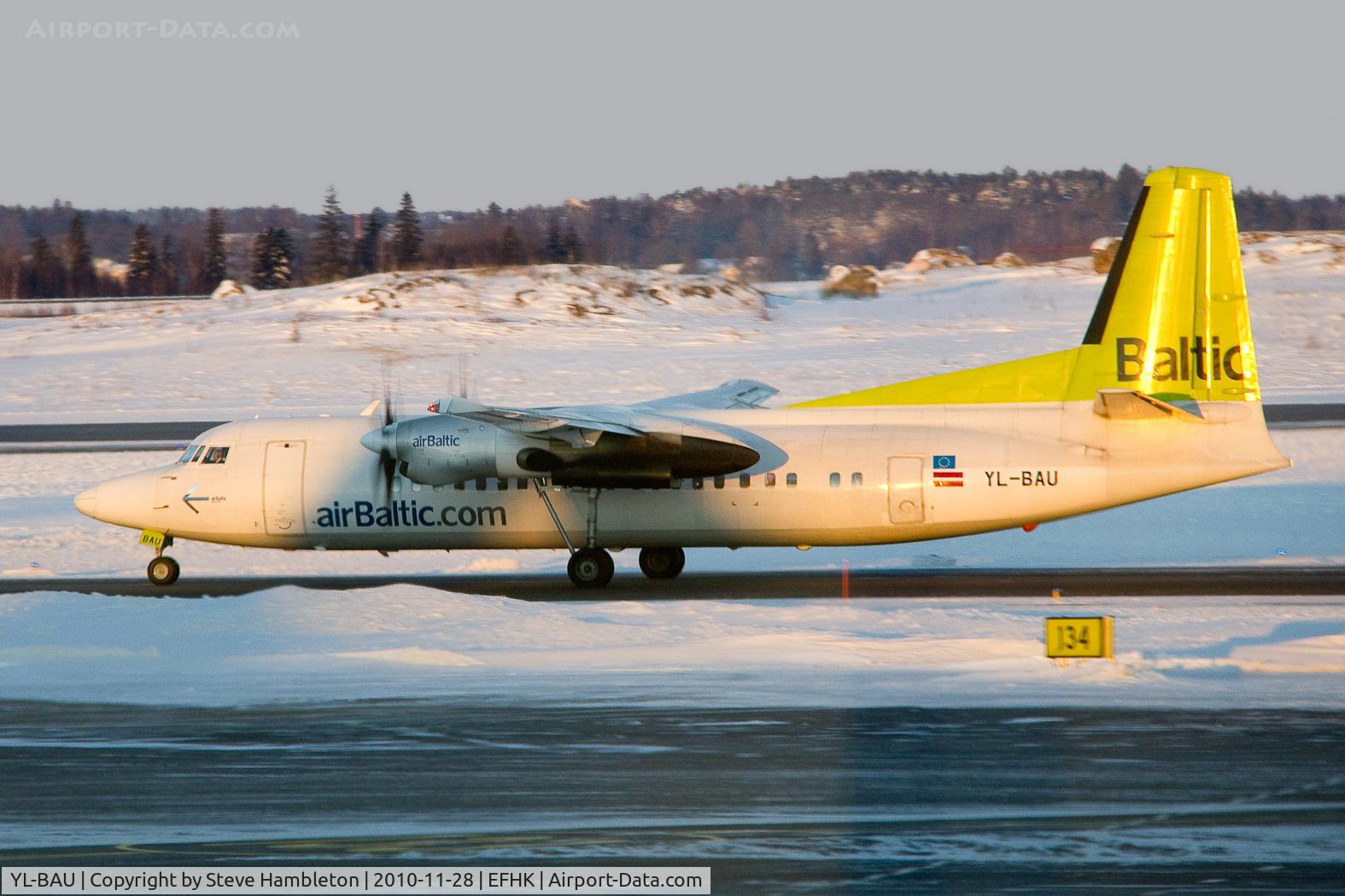 YL-BAU, 1988 Fokker 50 C/N 20126, Taken in the early morning light from inside Terminal 2