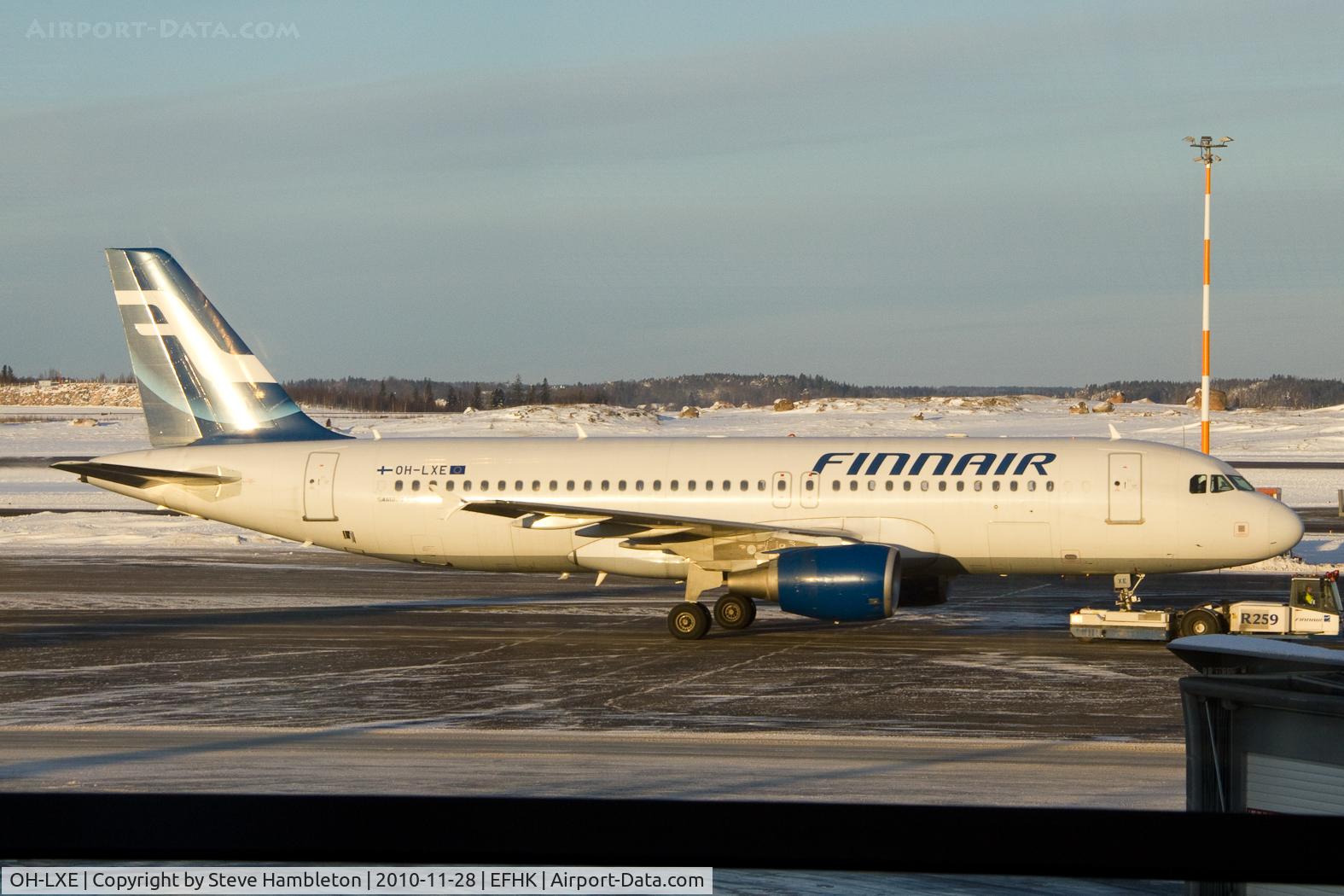 OH-LXE, 2001 Airbus A320-214 C/N 1678, Taken in the early morning light from inside Terminal 2