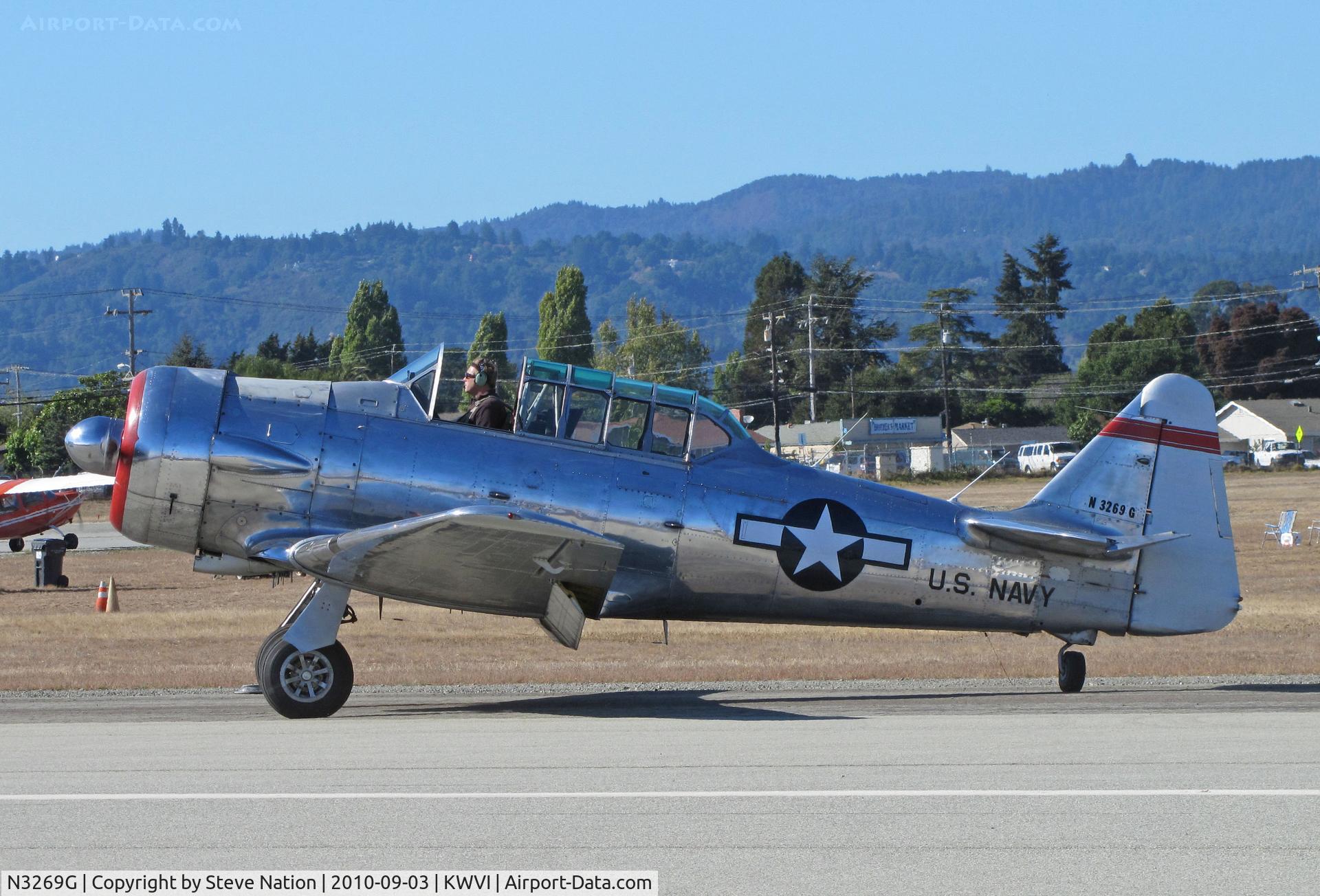 N3269G, North American SNJ-5C Texan Texan C/N 88-14704, Mostly brushed aluminum North American SNJ-5 with U.S. Navy titles and red tail band taxiing @ 2010 Watsonville Fly-In