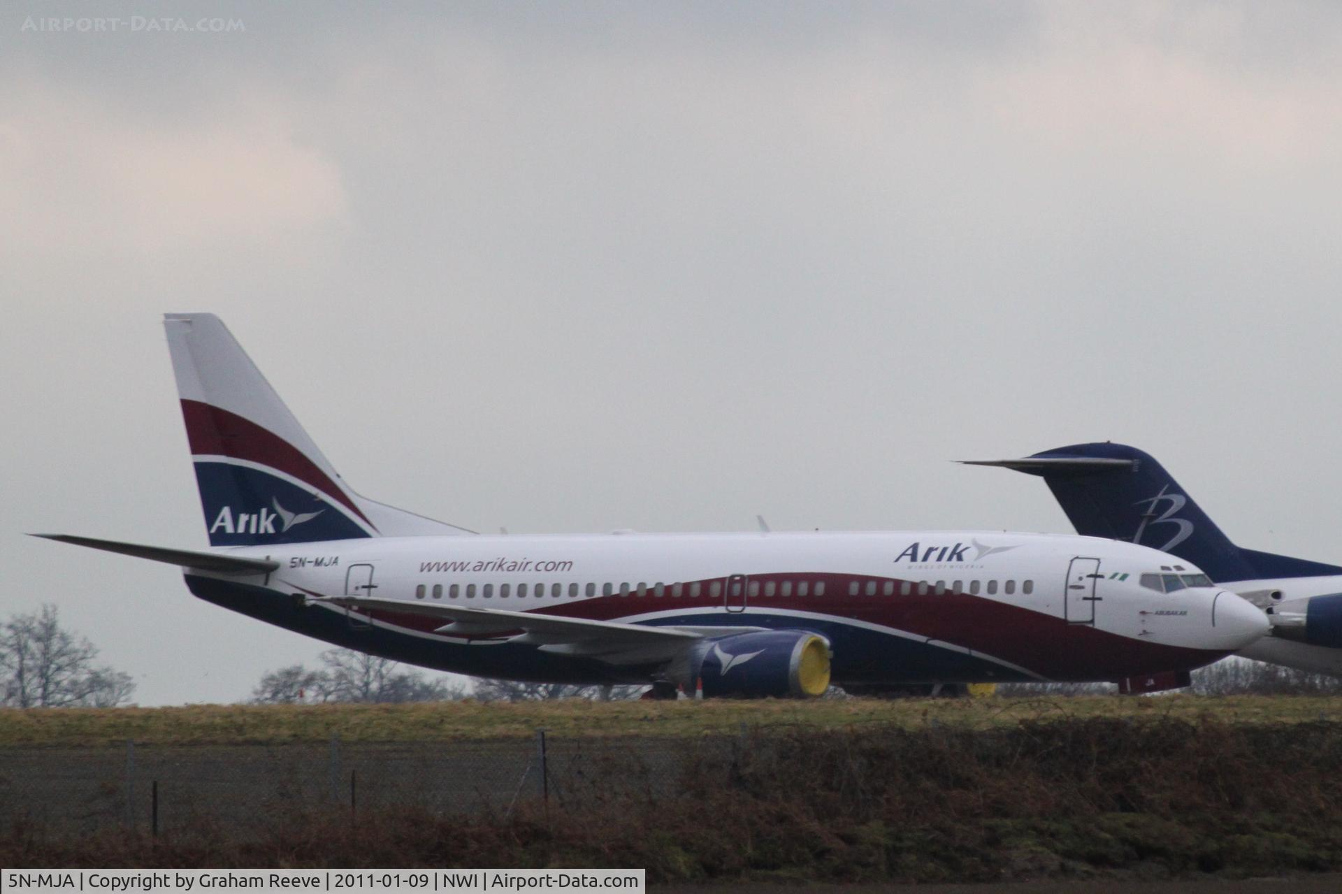 5N-MJA, 1989 Boeing 737-322 C/N 24454, Parked with stored aircraft.