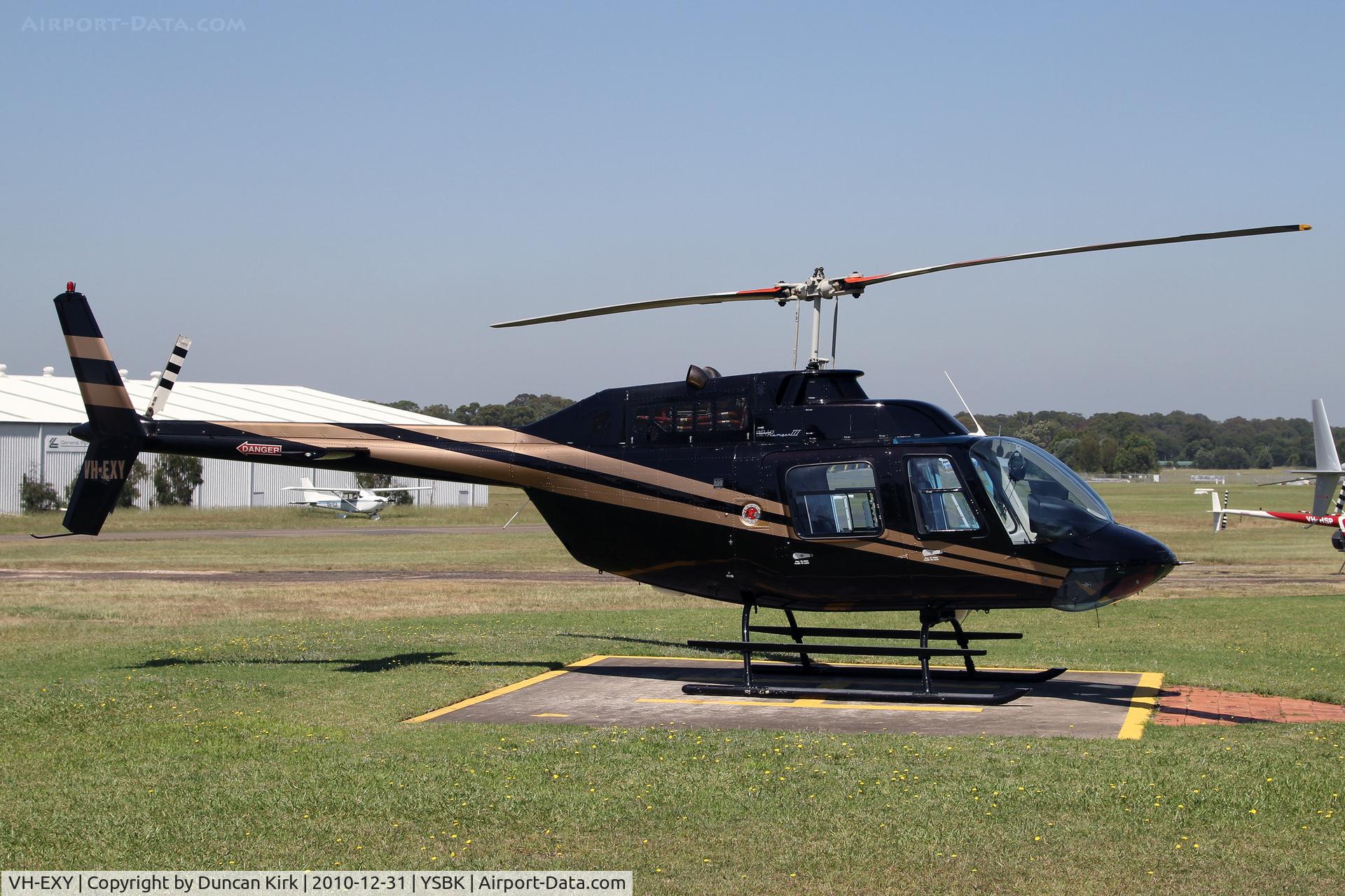 VH-EXY, Bell 206 C/N 04673, Looking like a John Players Special scheme!