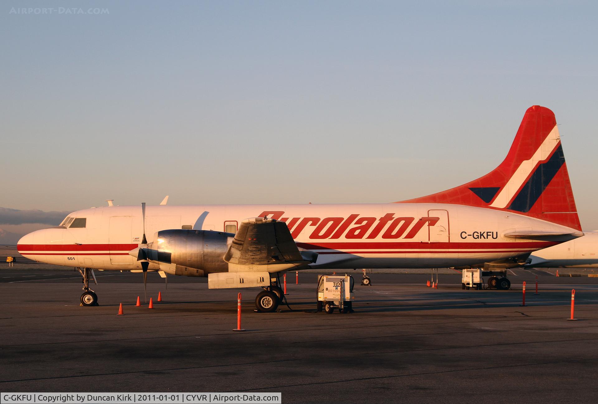 C-GKFU, 1953 Convair 340 C/N 82, Kelowna Flight Convair C-GKFU operated by Purolator. Seen at Vancouver first light on new year's day 2011.