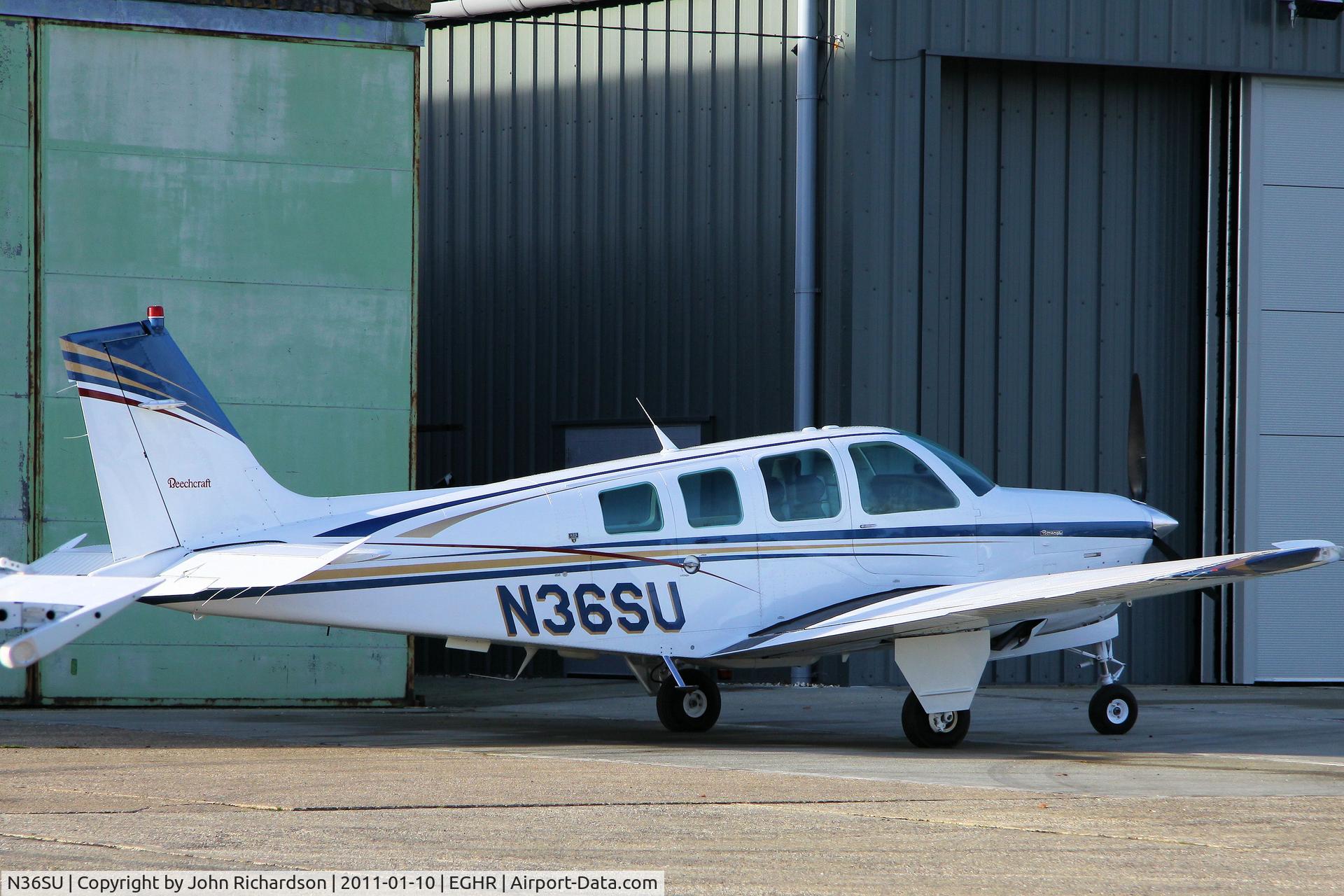 N36SU, 1996 Raytheon A36 Bonanza C/N E-3034, Parked outside Maintenance Hangar