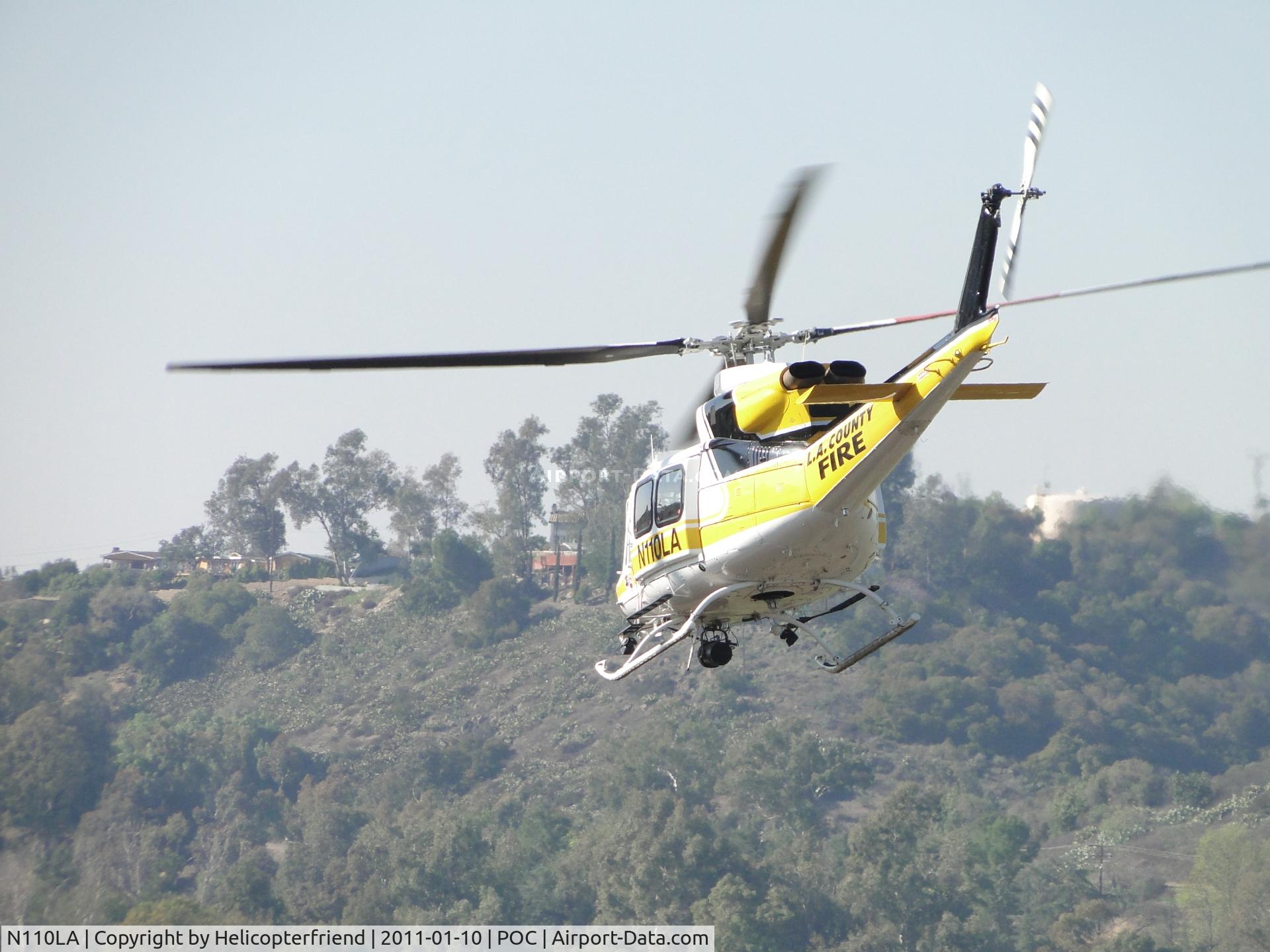 N110LA, 2005 Bell 412EP C/N 36392, Headed westbound down taxiway Sierra
