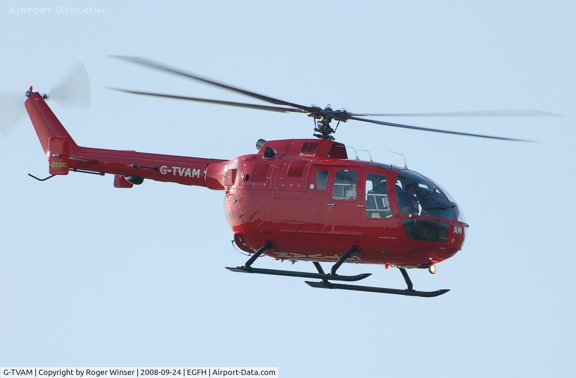 G-TVAM, 1979 MBB Bo-105DBS-4 C/N S-392, Bond Air Services air ambulance helicopter over the airport..