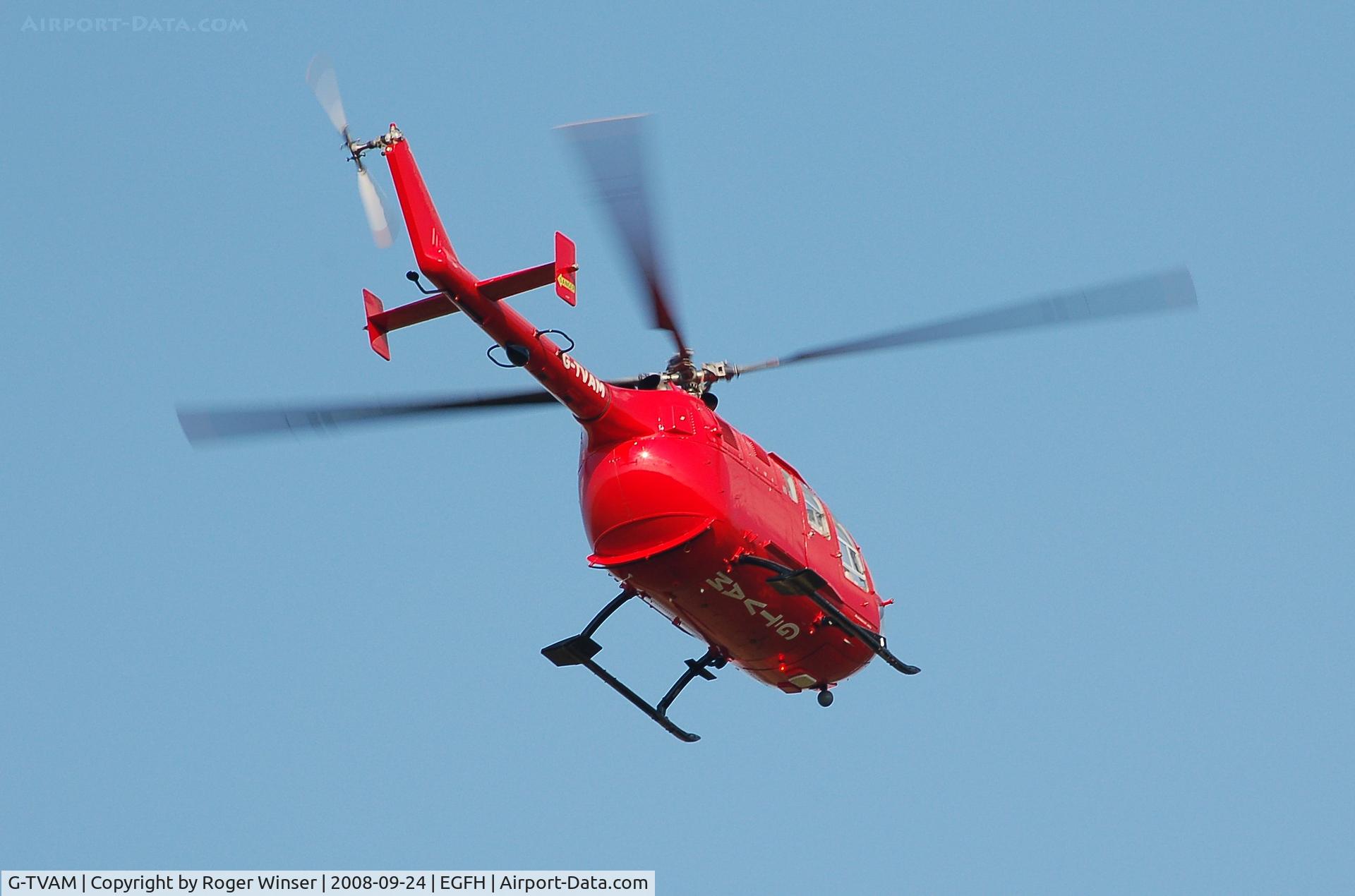 G-TVAM, 1979 MBB Bo-105DBS-4 C/N S-392, Bond Air Services air ambulance helicopter over the airport.