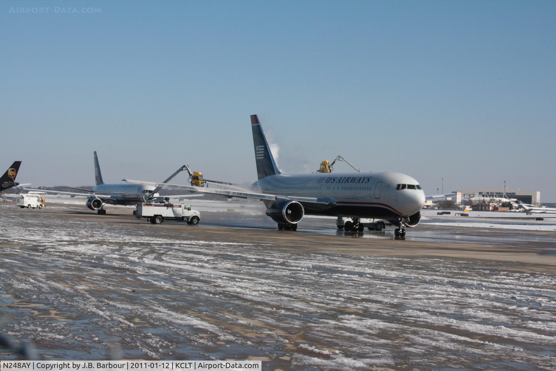 N248AY, 1988 Boeing 767-201 C/N 23900, De-icing after this nasty snow hit.